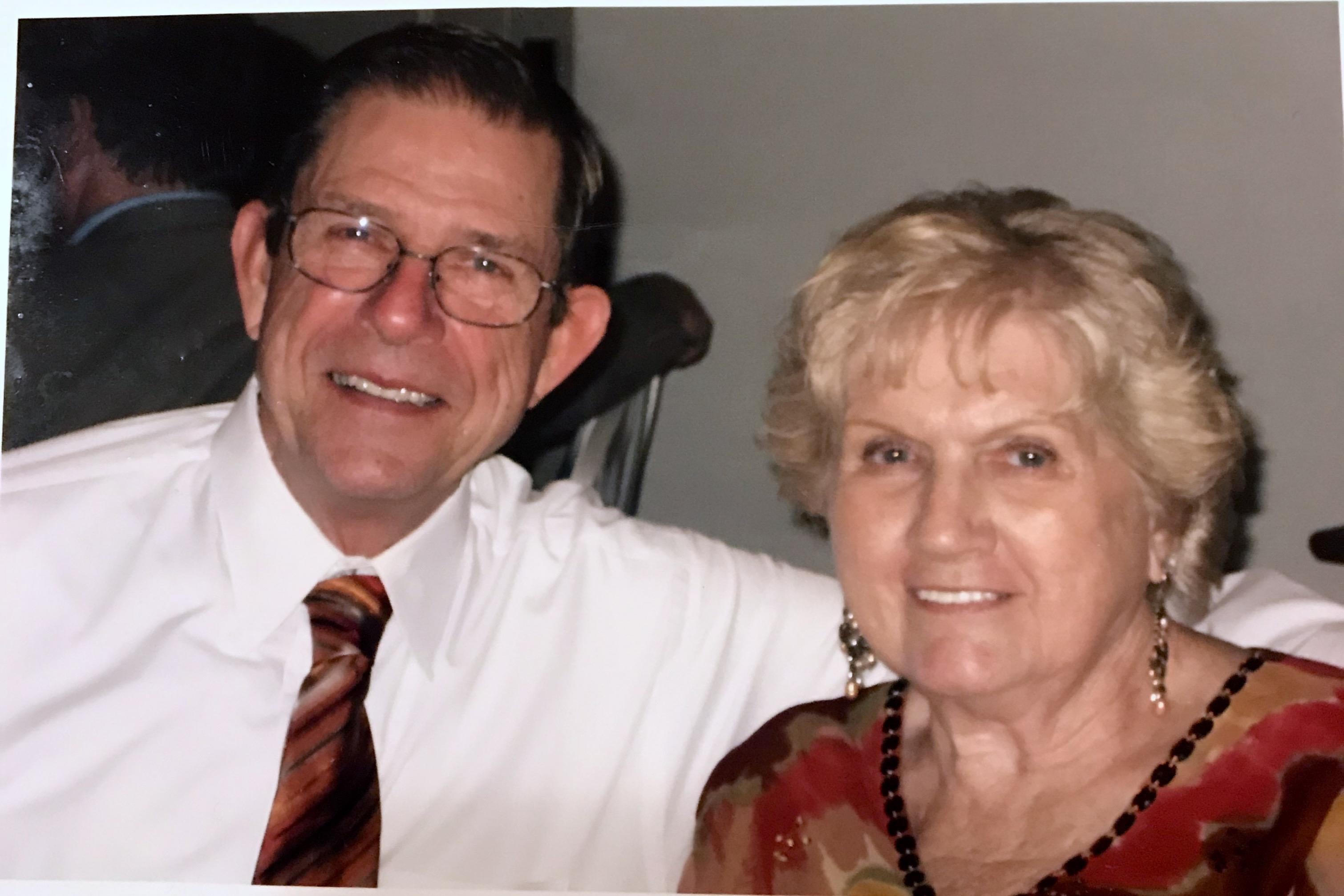 A man and woman smiling for a picture