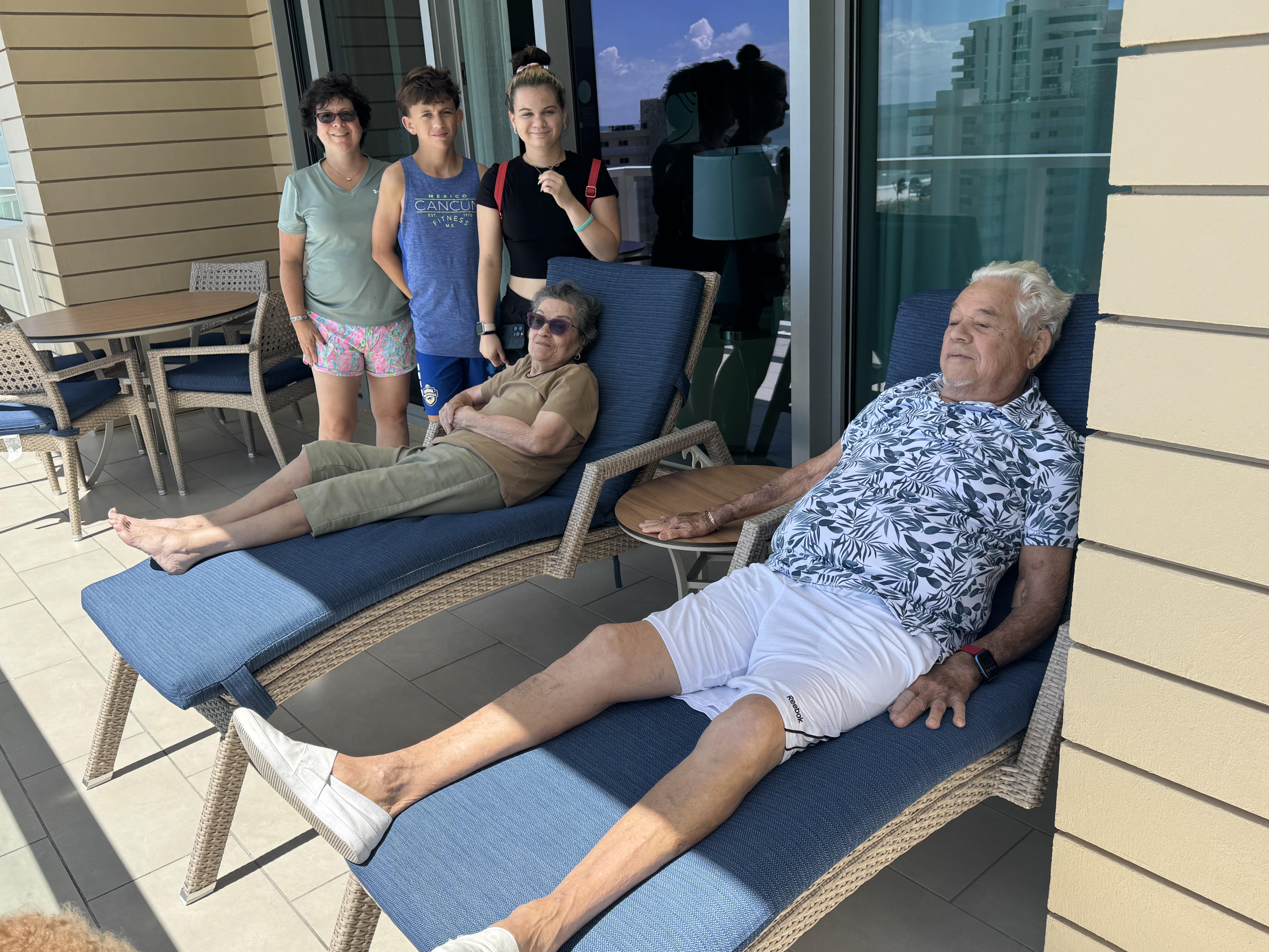 A group of people on a deck chair