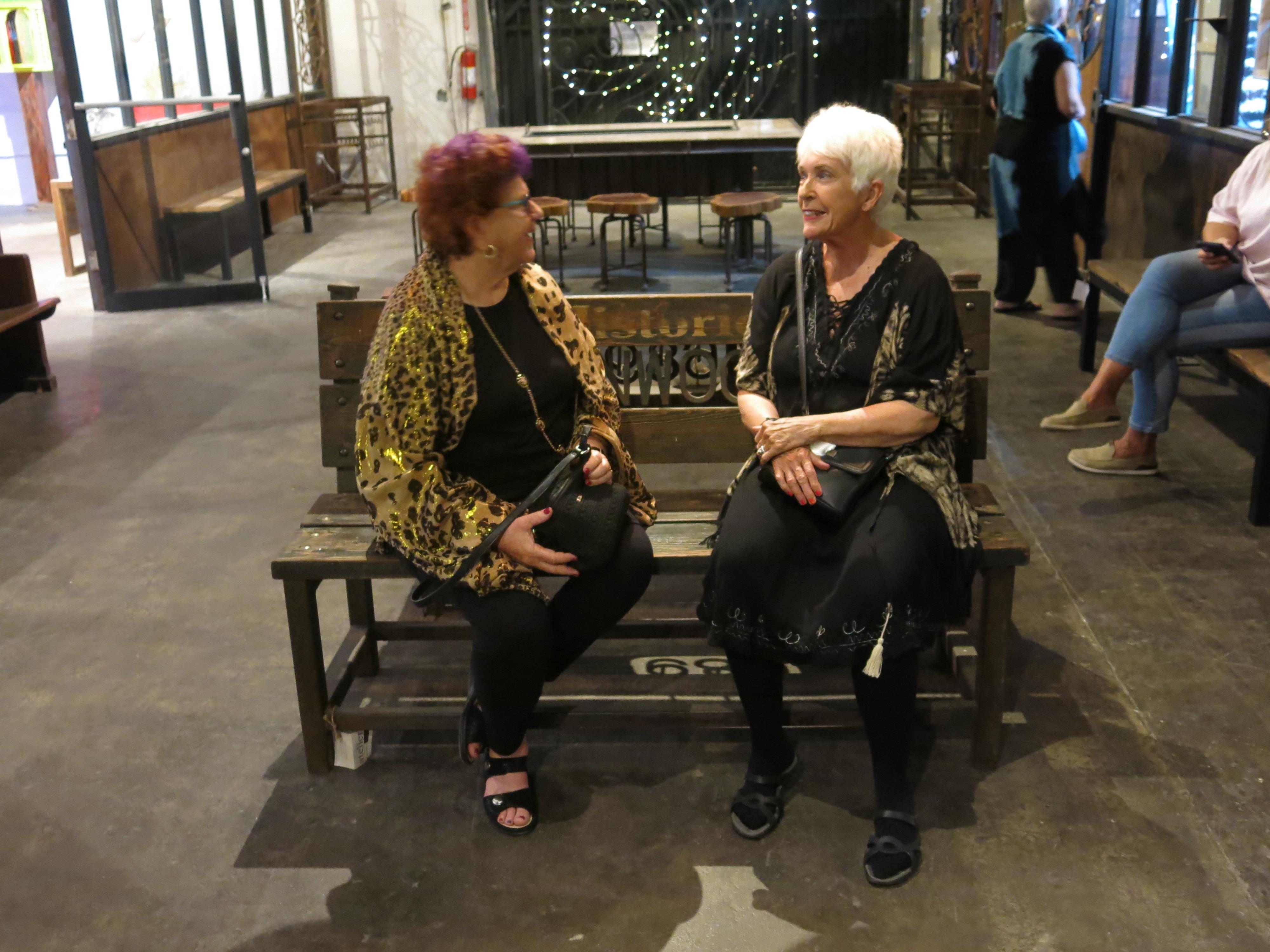 Two women sitting on a bench