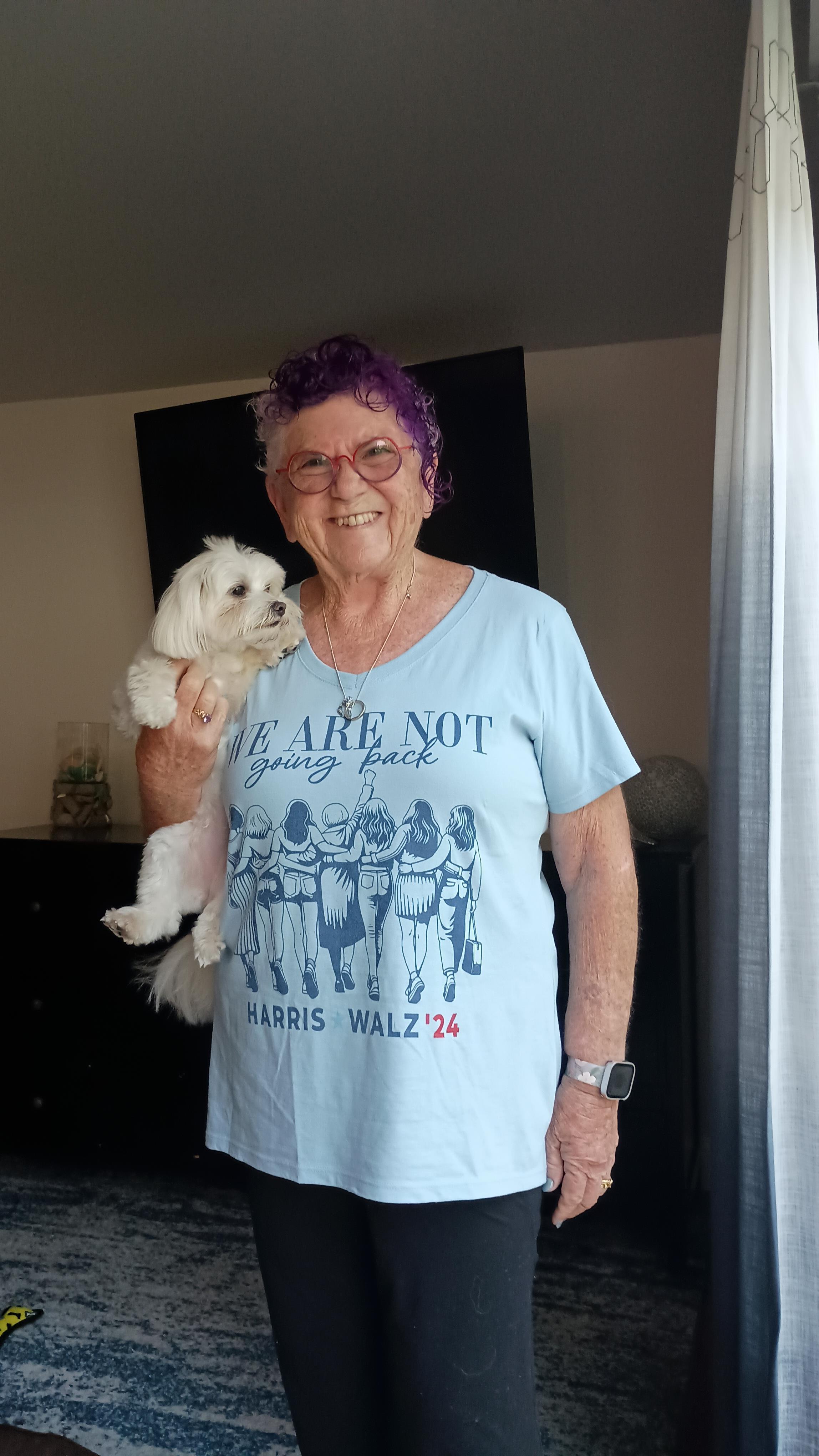 A woman holding a dog