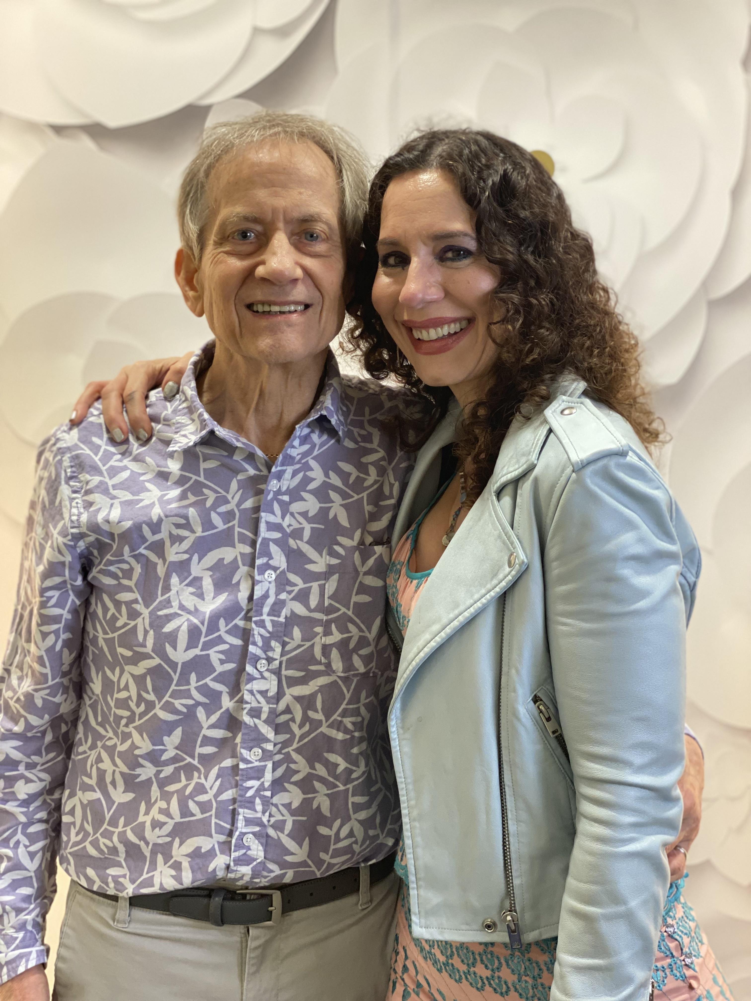 A man and woman posing for a picture