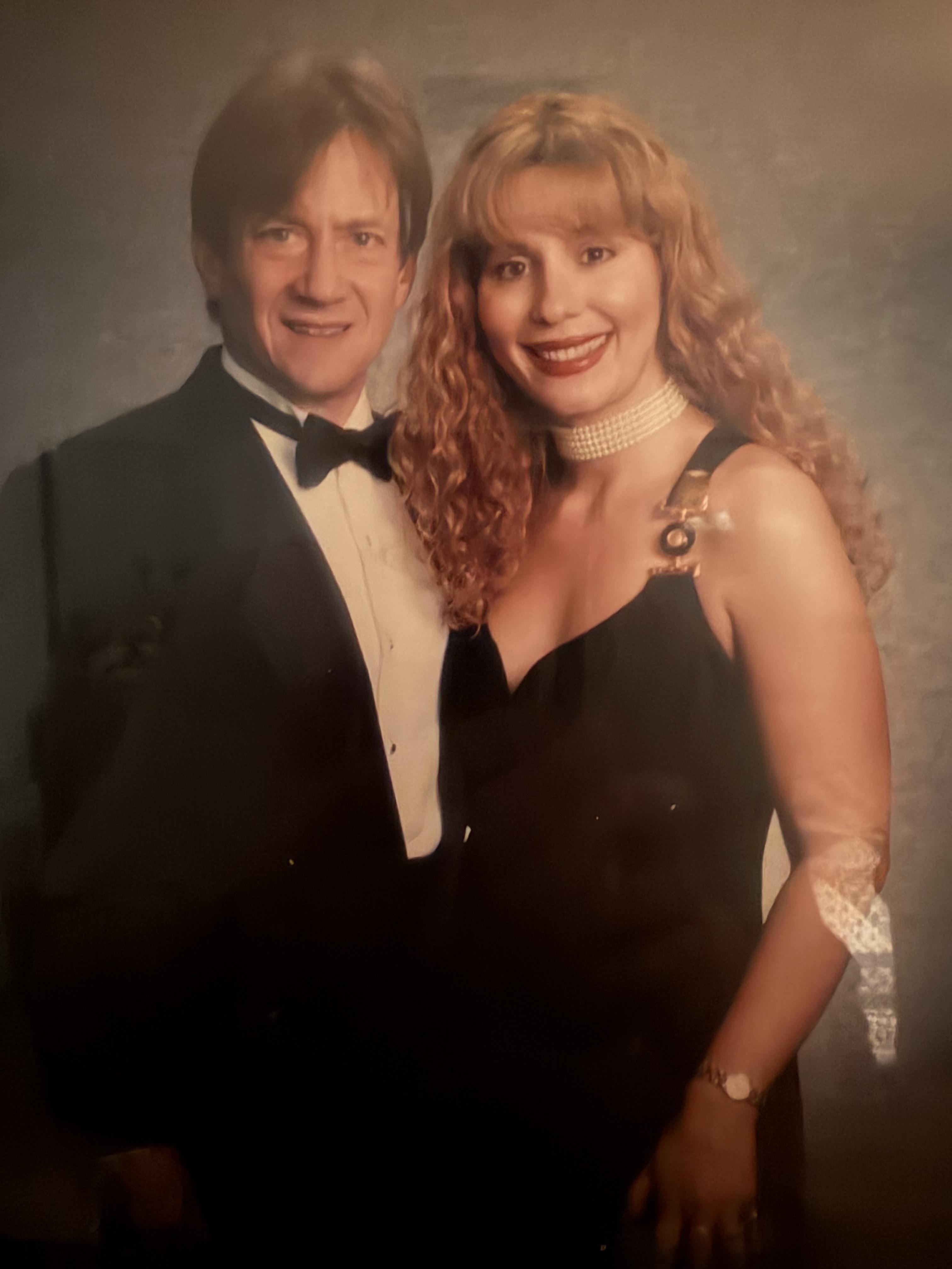 A man and woman posing for a picture