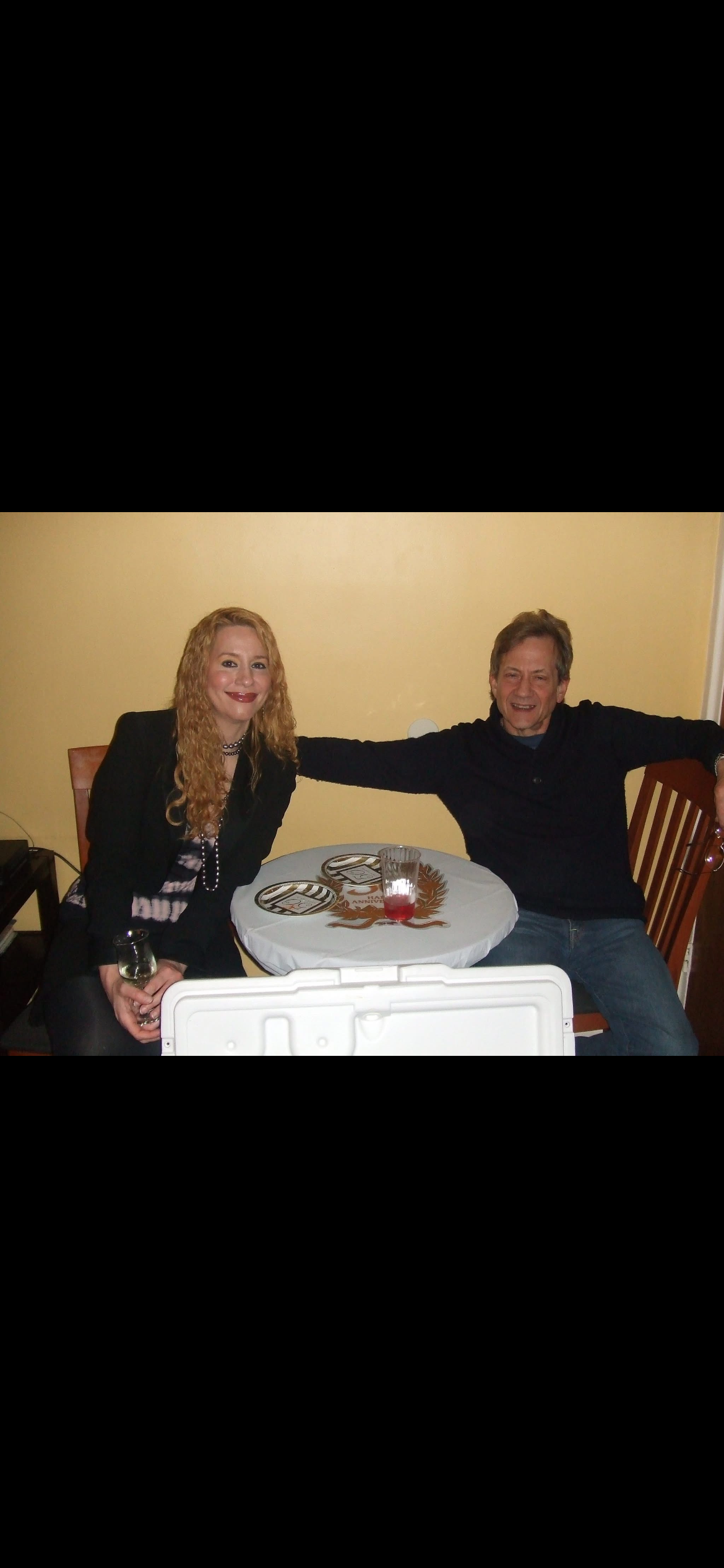 A man and woman sitting at a table