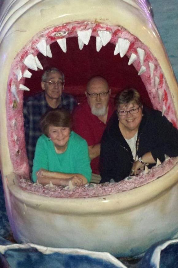 A group of people in a shark mouth