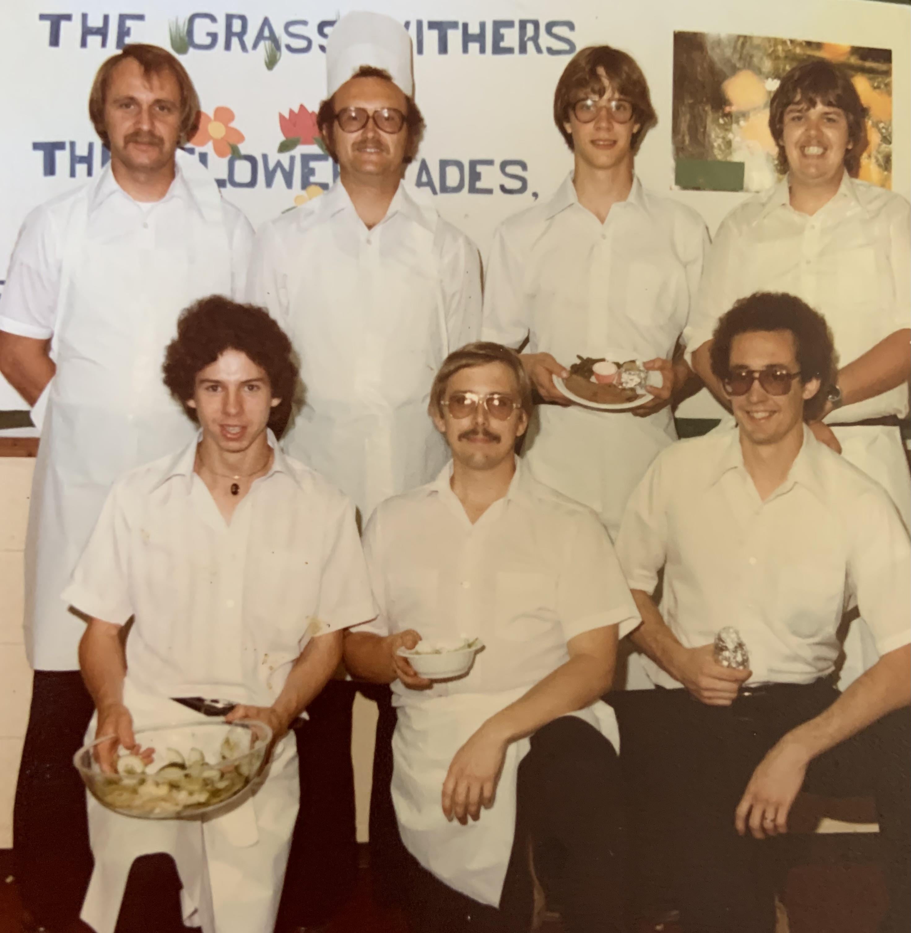 A group of men in white uniforms