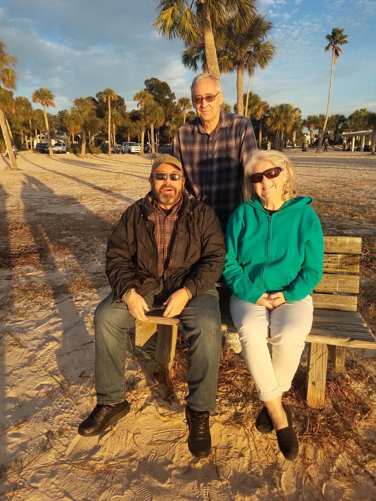 A group of people sitting on a bench