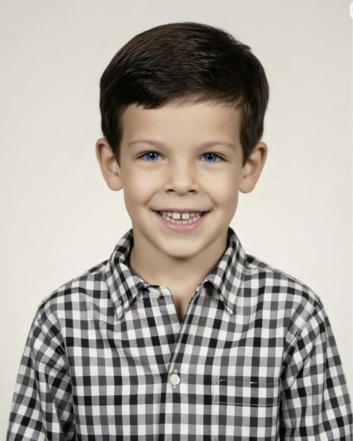 A boy smiling at the camera