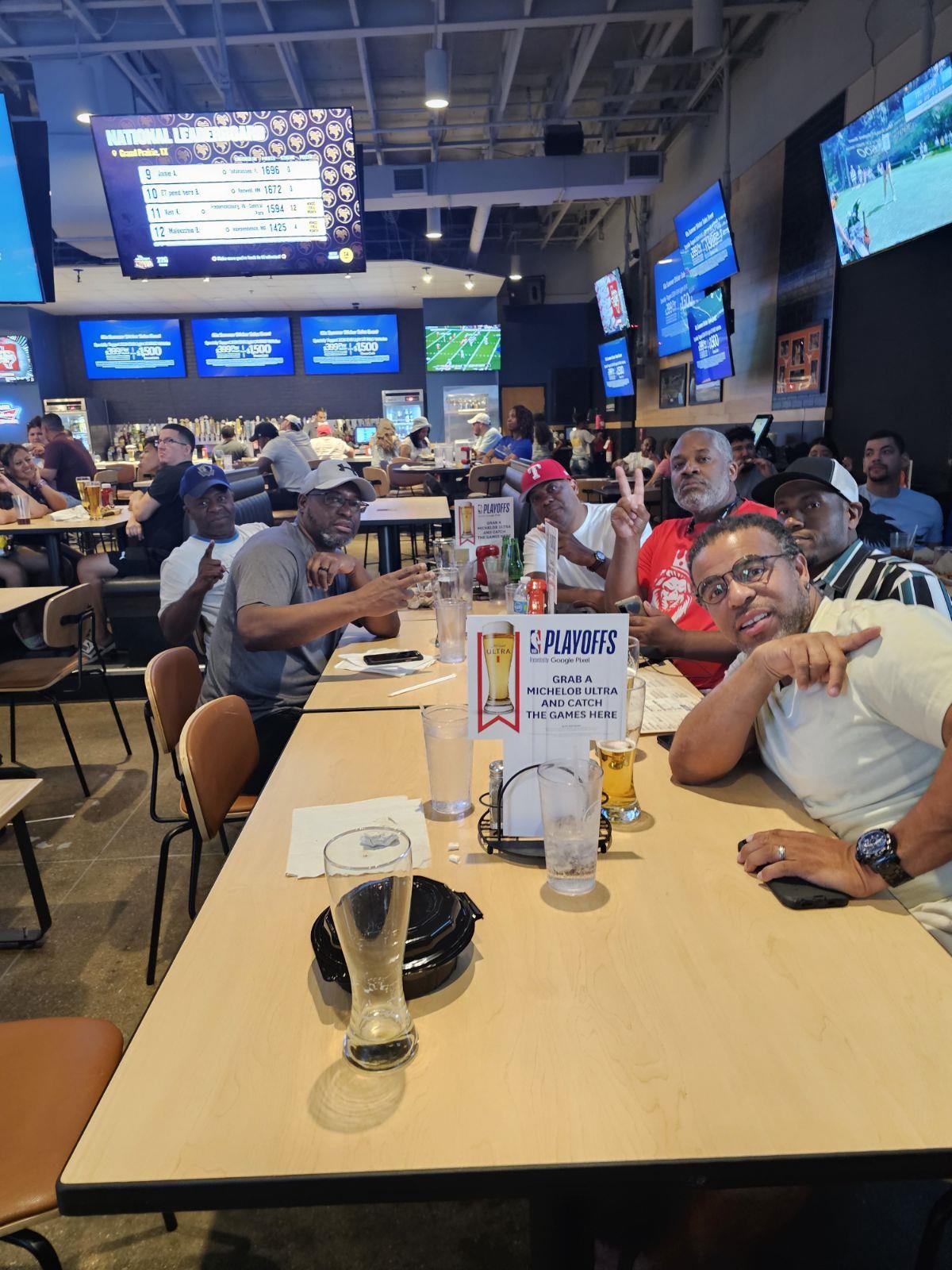 A group of people sitting at a table