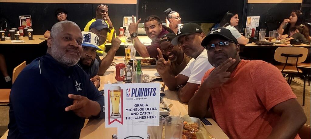 A group of people sitting at a table