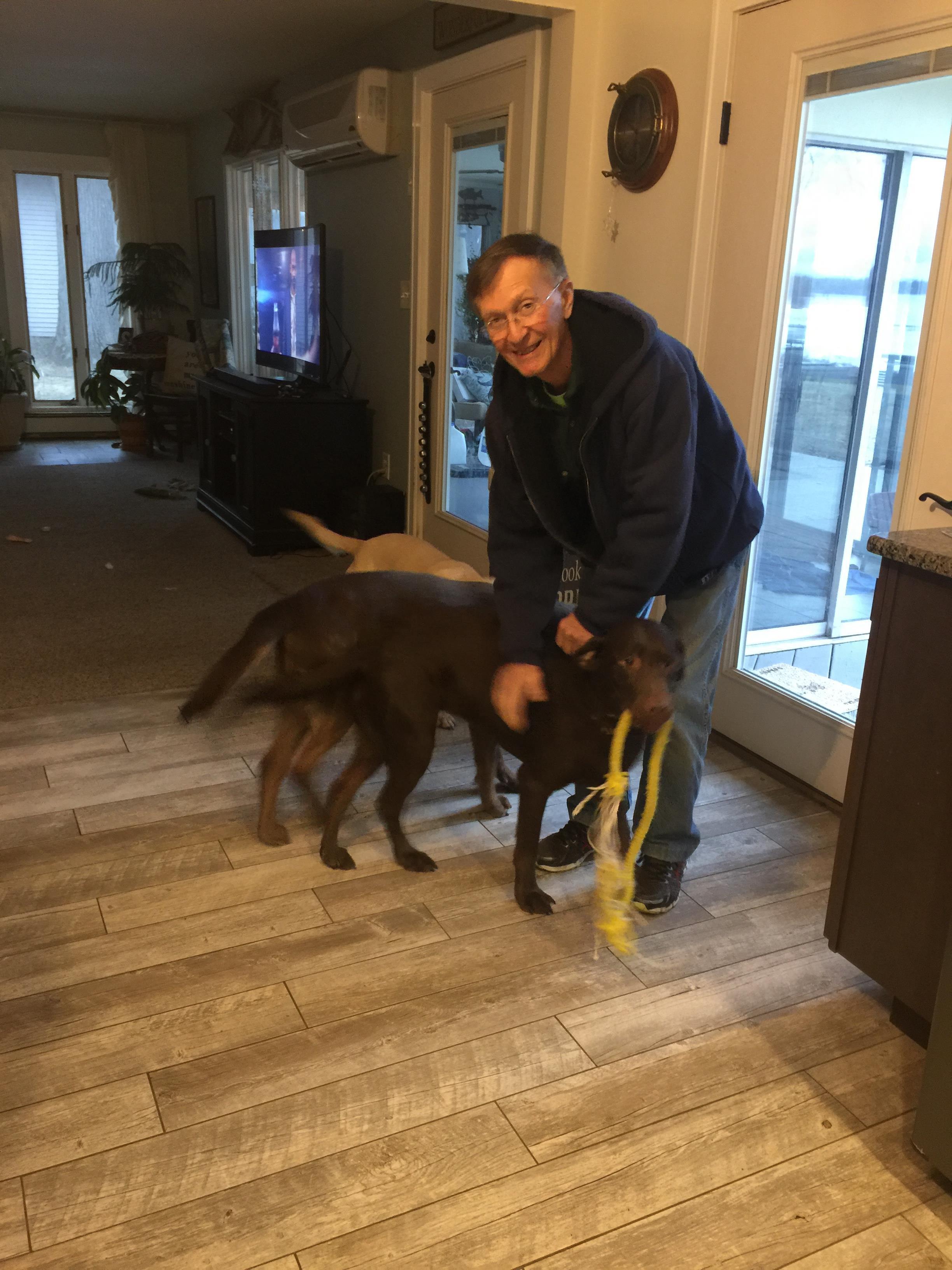 A man holding a dog