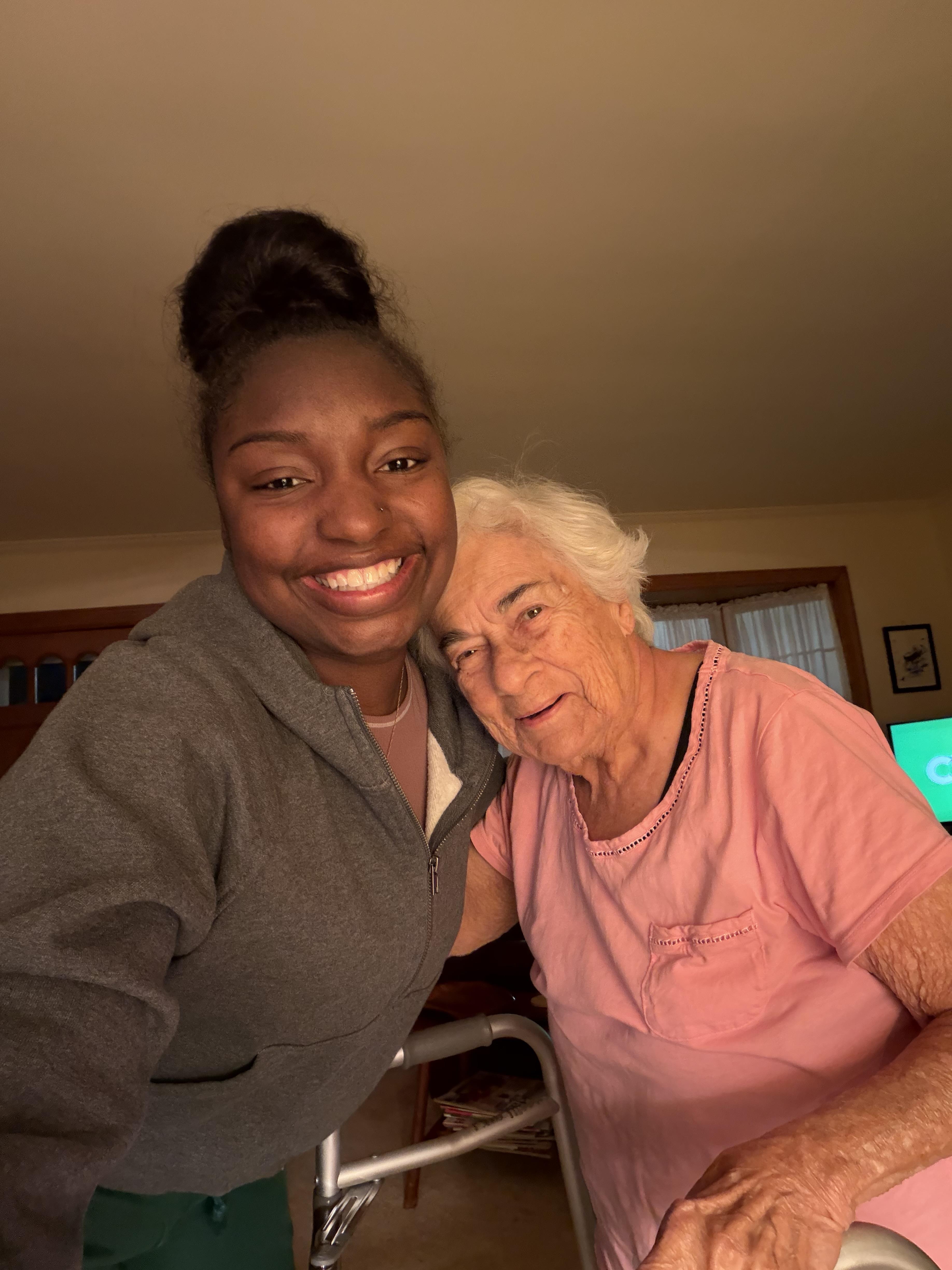 A woman and an older woman smiling
