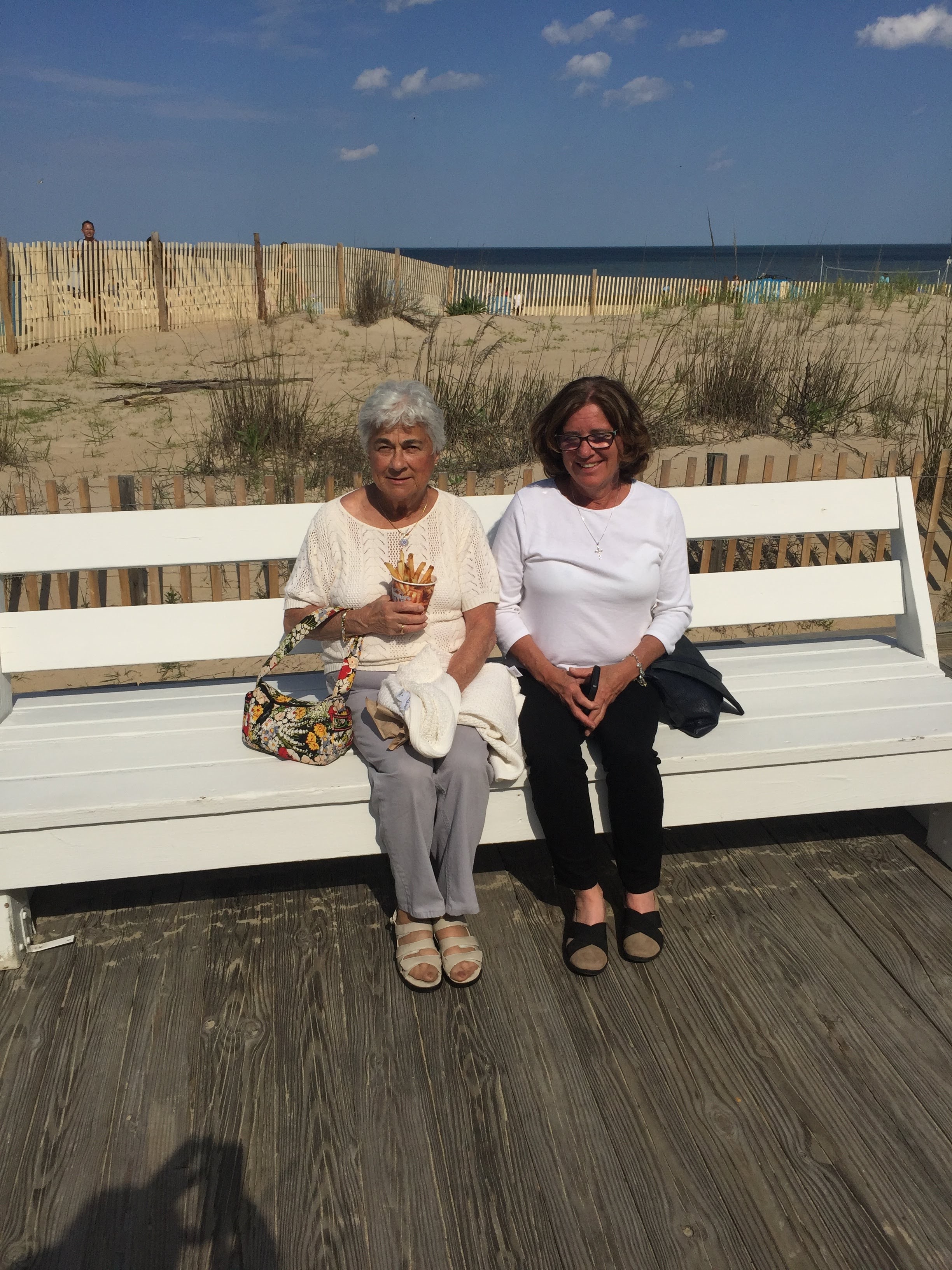 Two women sitting on a bench