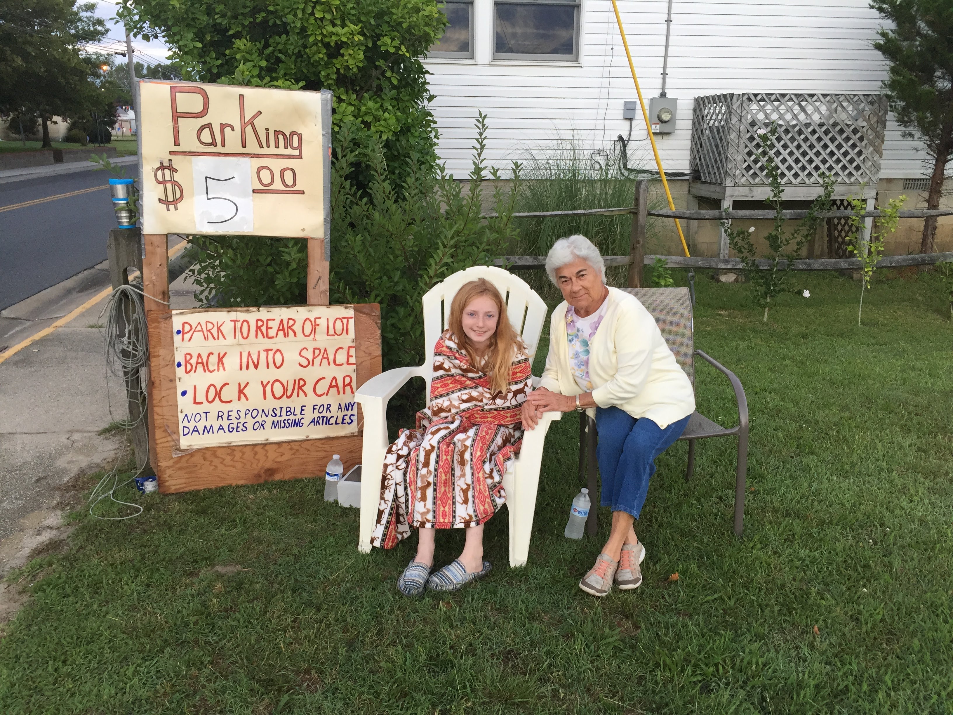 A woman and a girl sitting in chairs