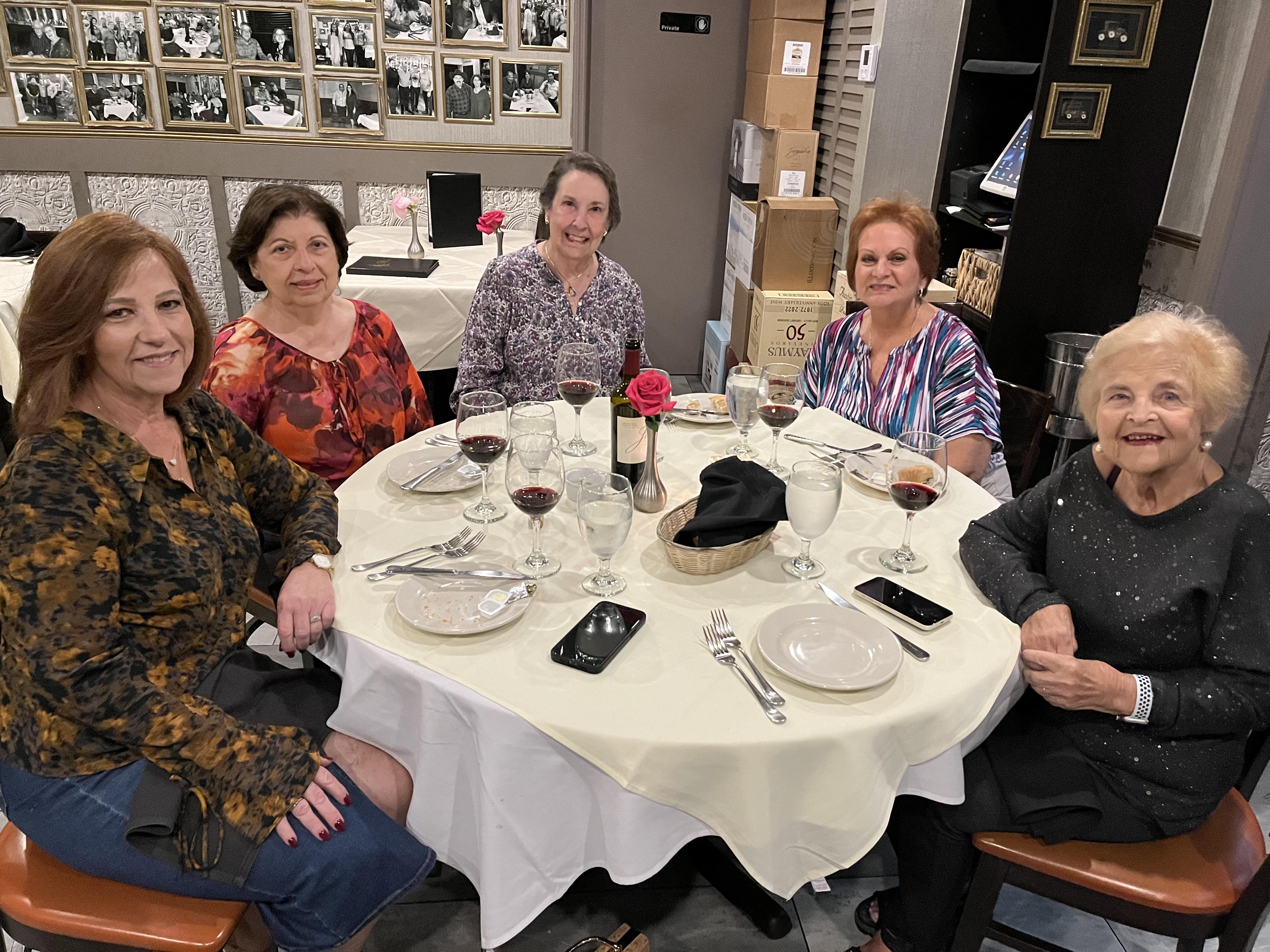 A group of women sitting at a table