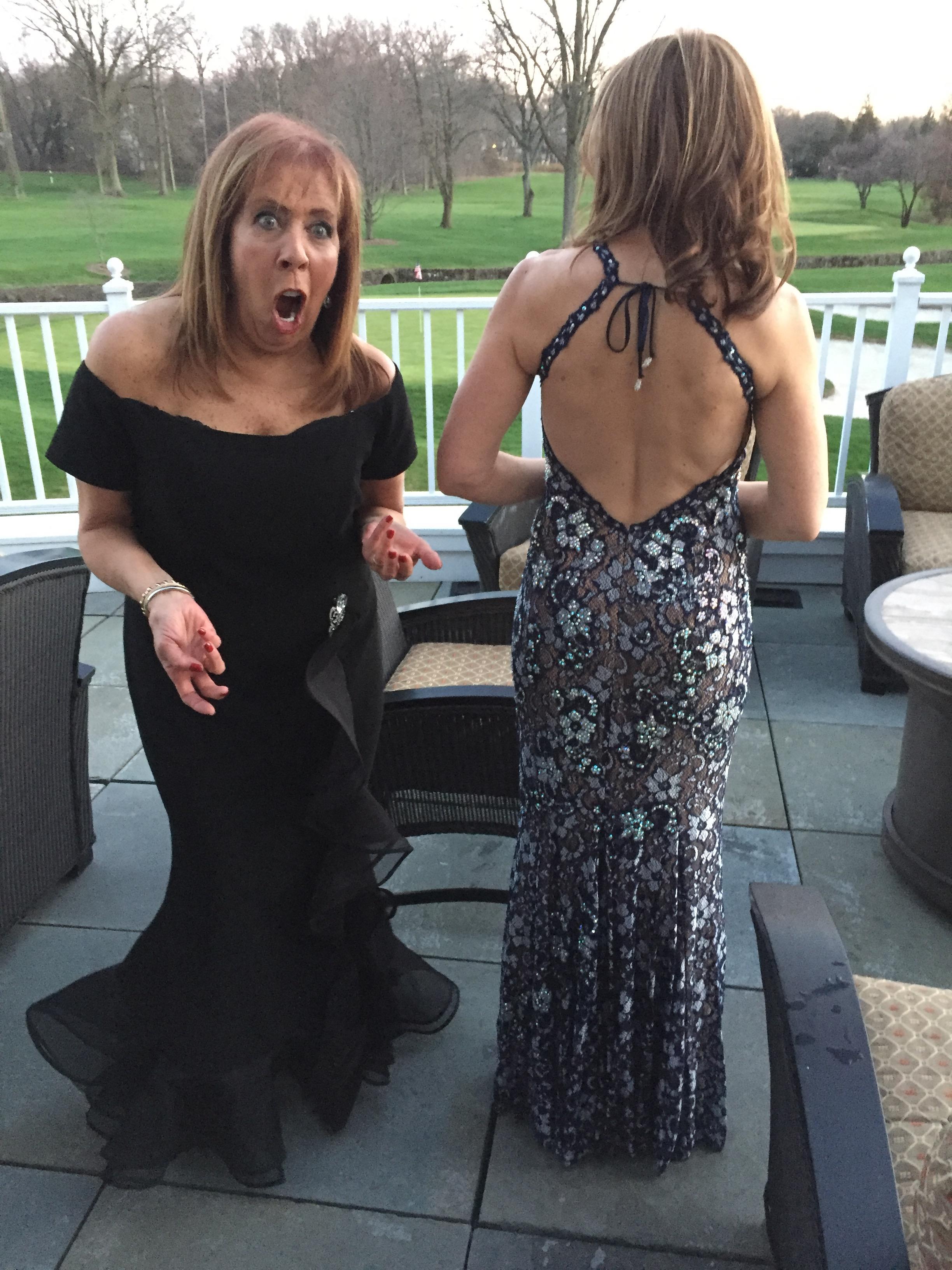 Two women in formal dresses