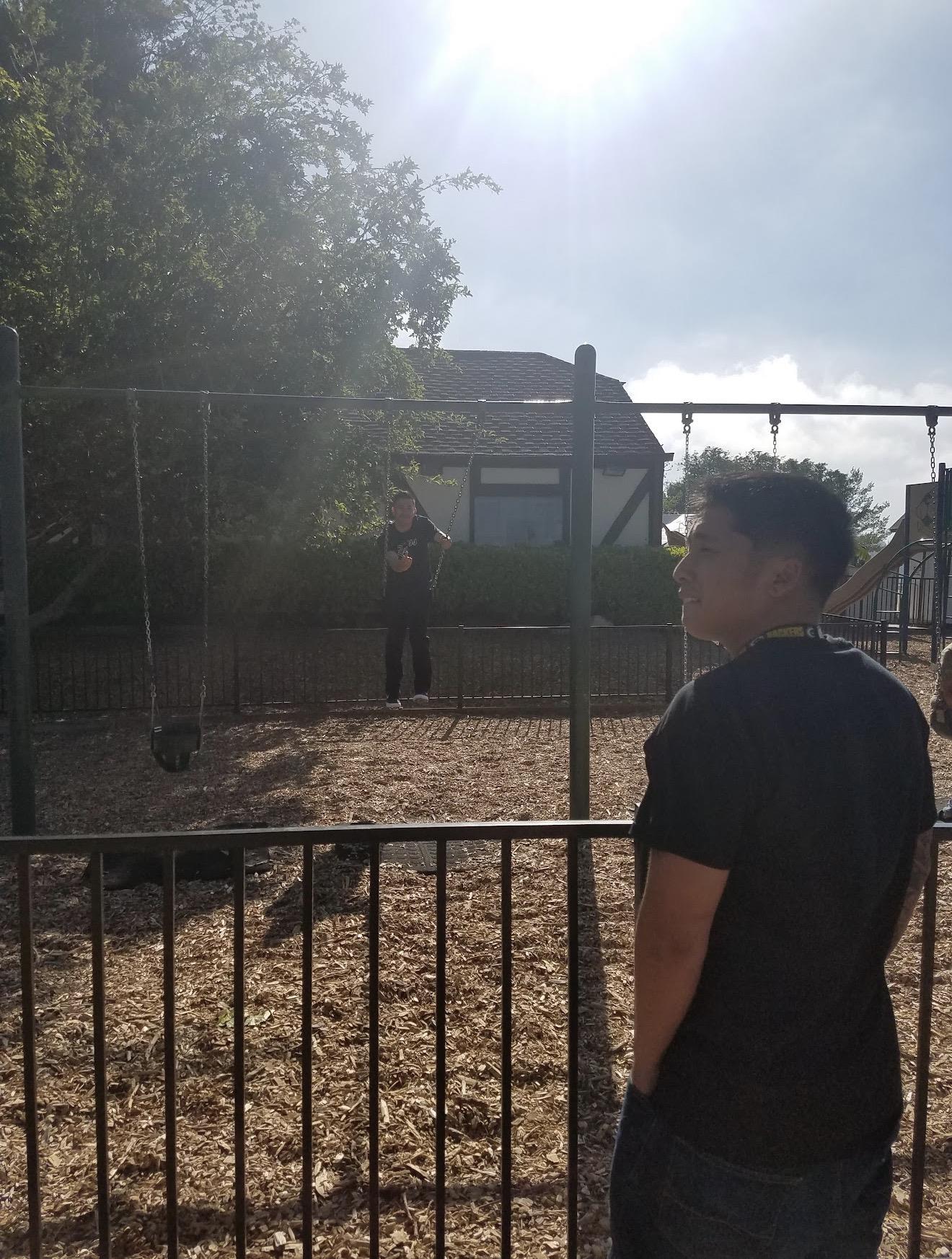A man standing in a playground