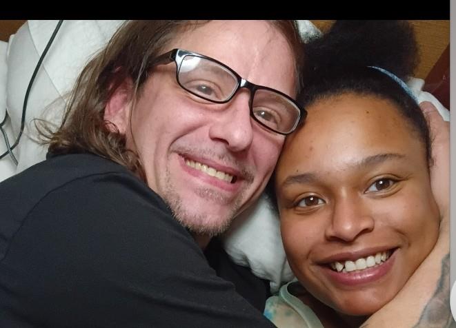 A man and woman taking a selfie