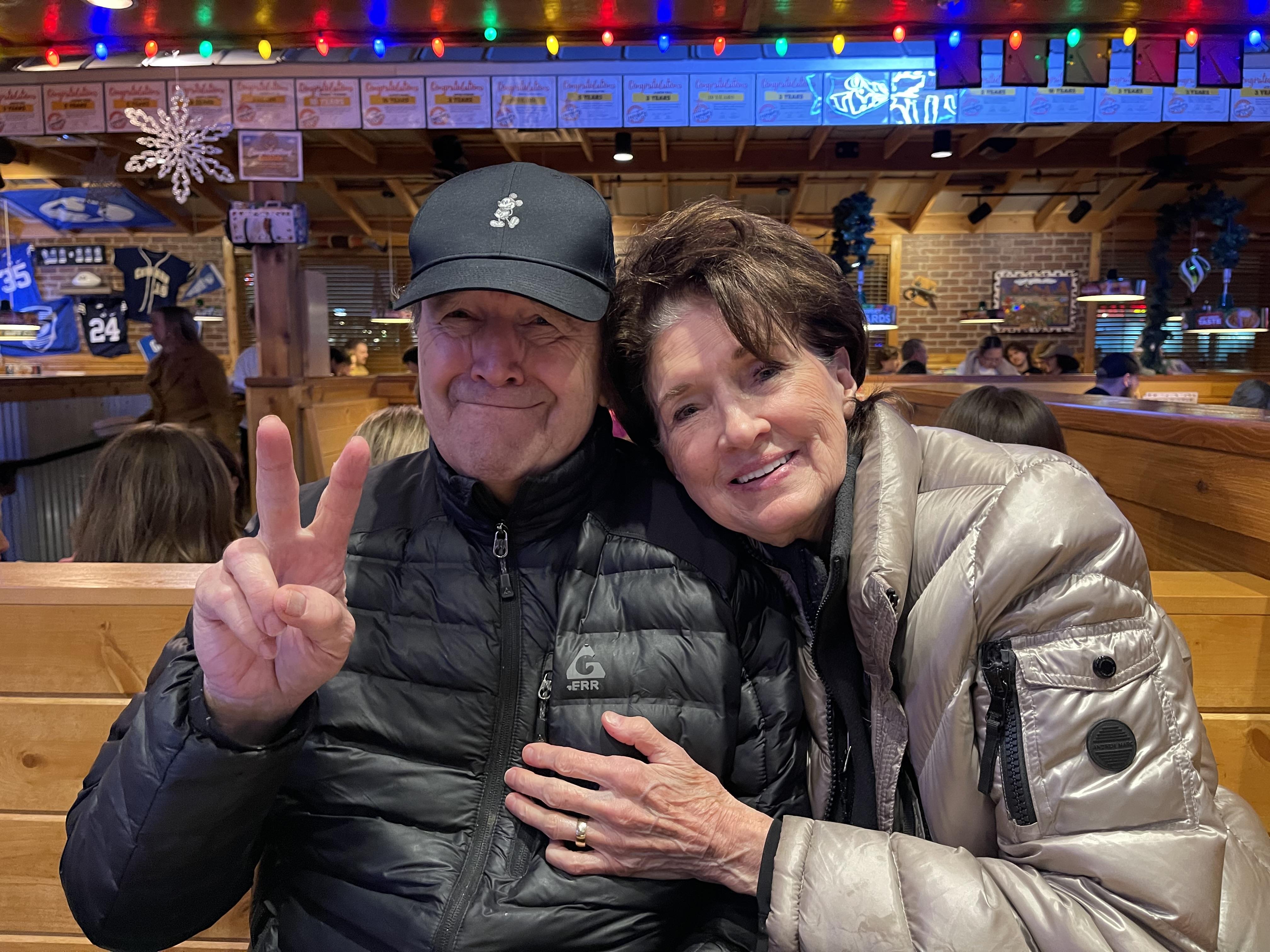 A man and woman posing for a picture