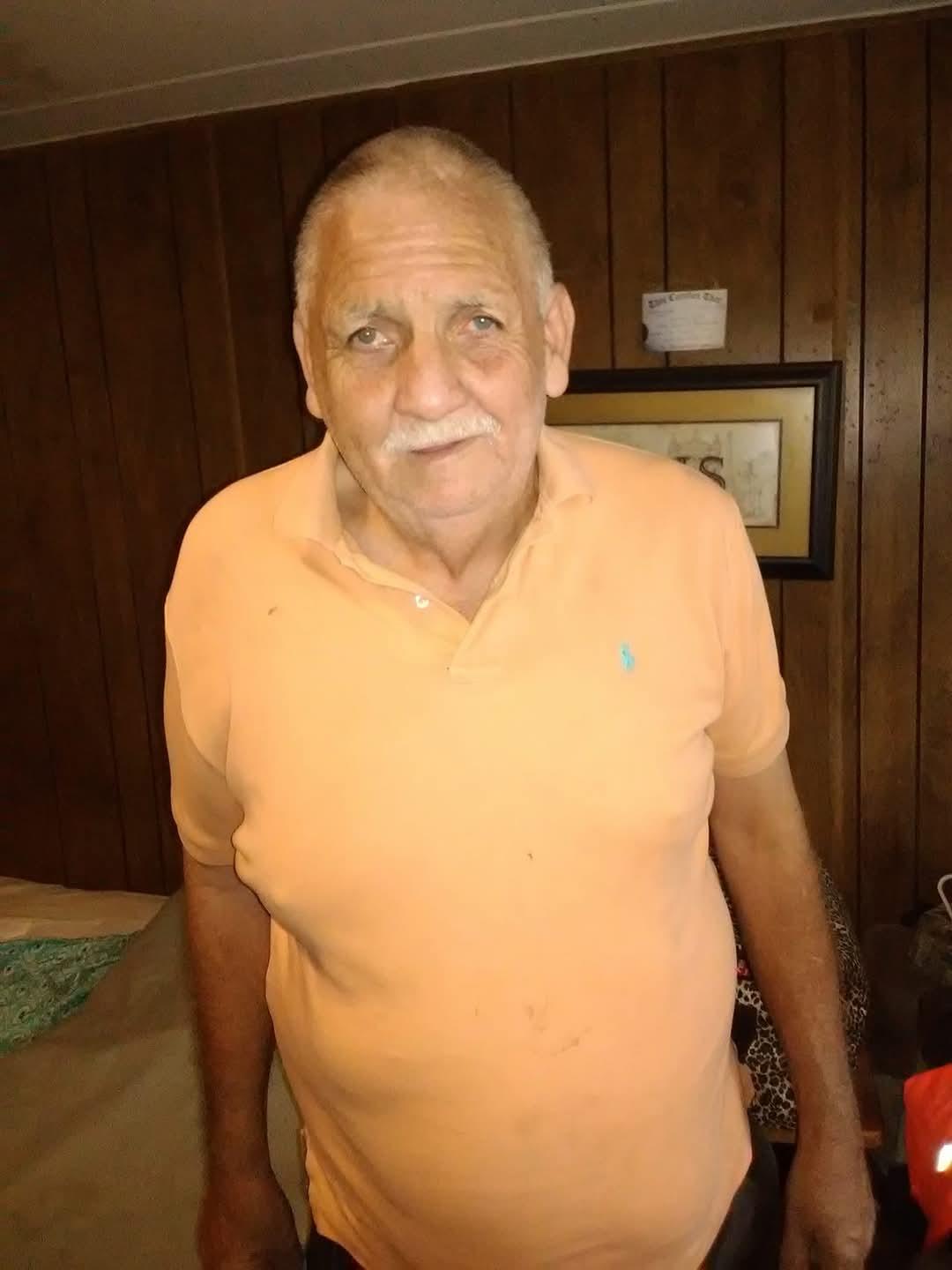 A man in an orange shirt