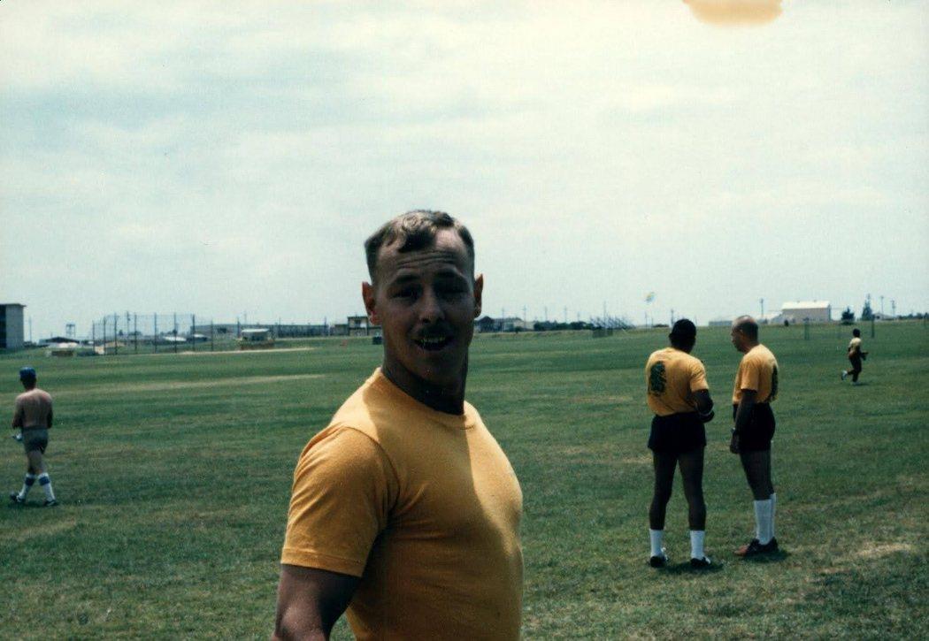 A man in a yellow shirt