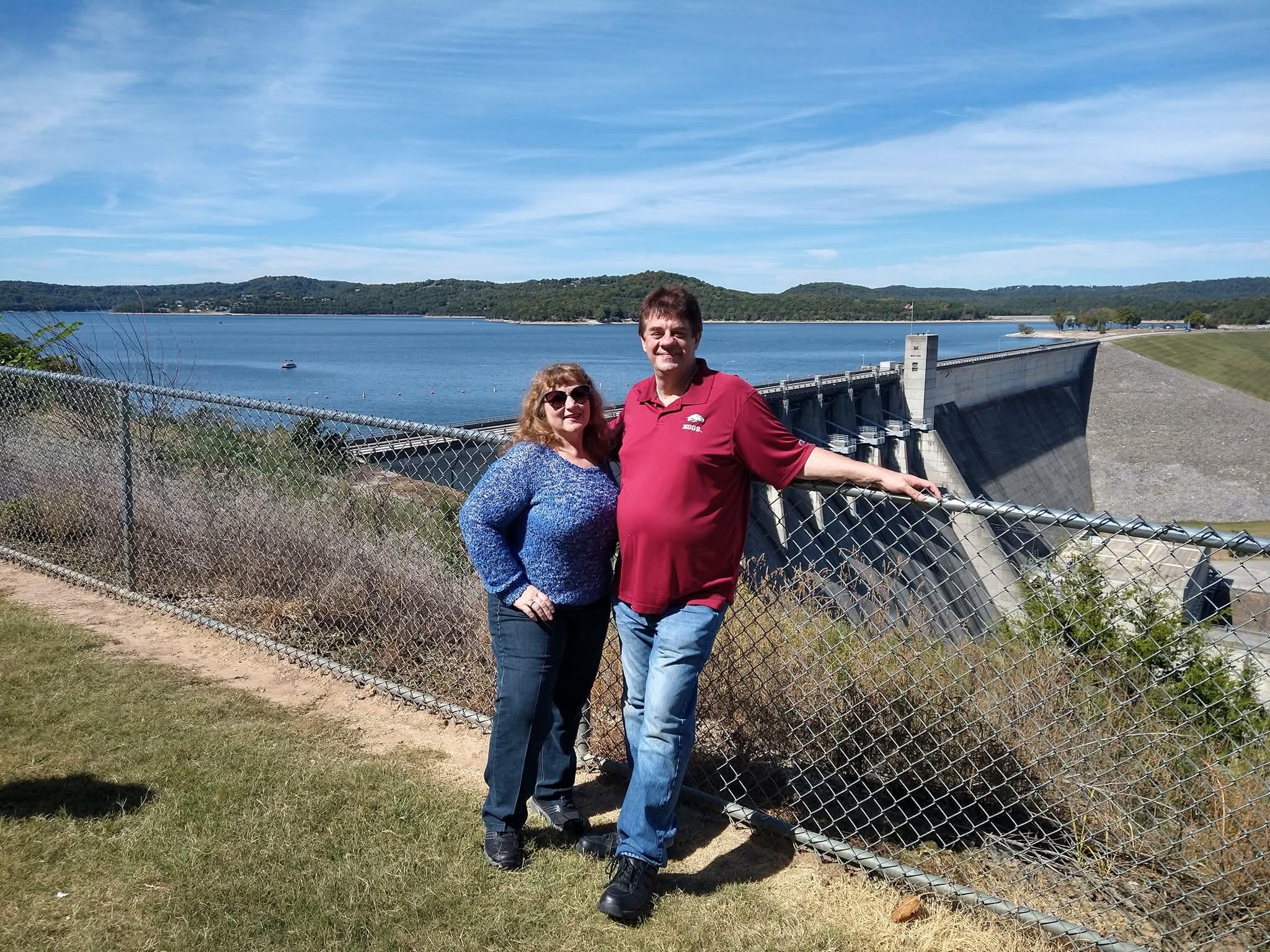 A man and woman posing for a picture