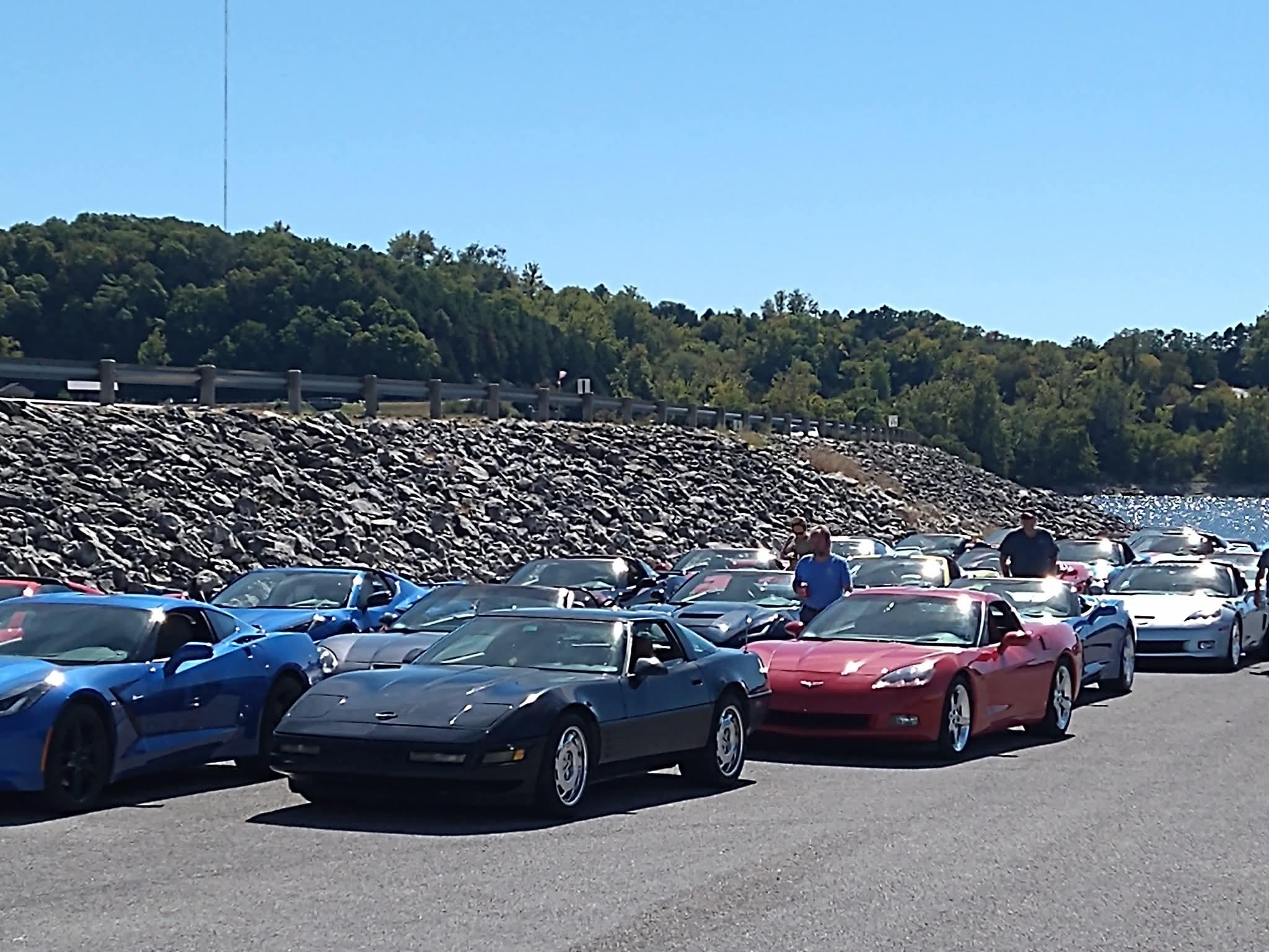 A group of cars parked on a road