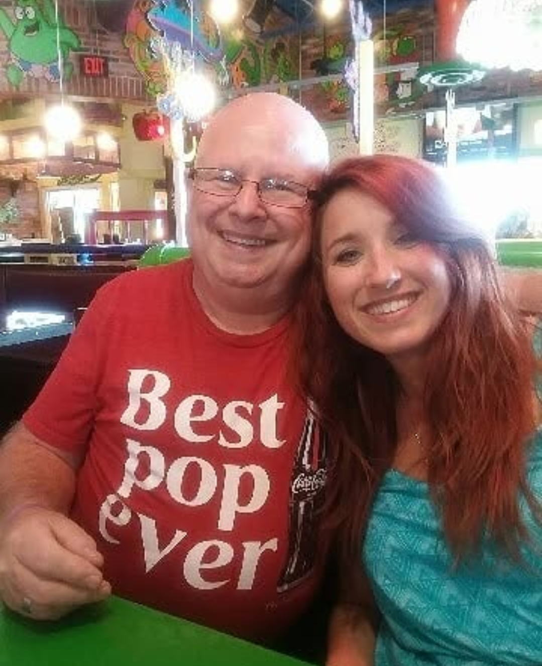A man and woman sitting together smiling