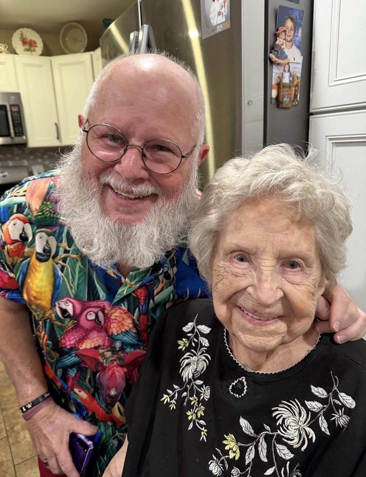A man and woman posing for a picture