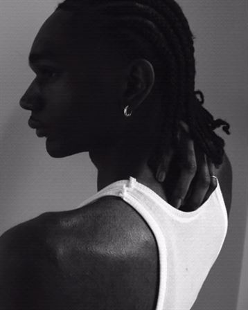 A man in a white tank top