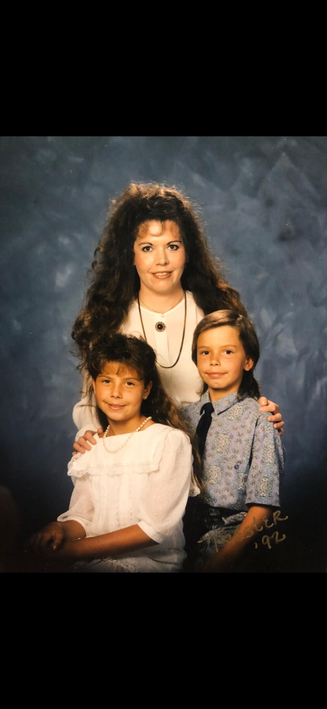 A woman and children posing for a picture