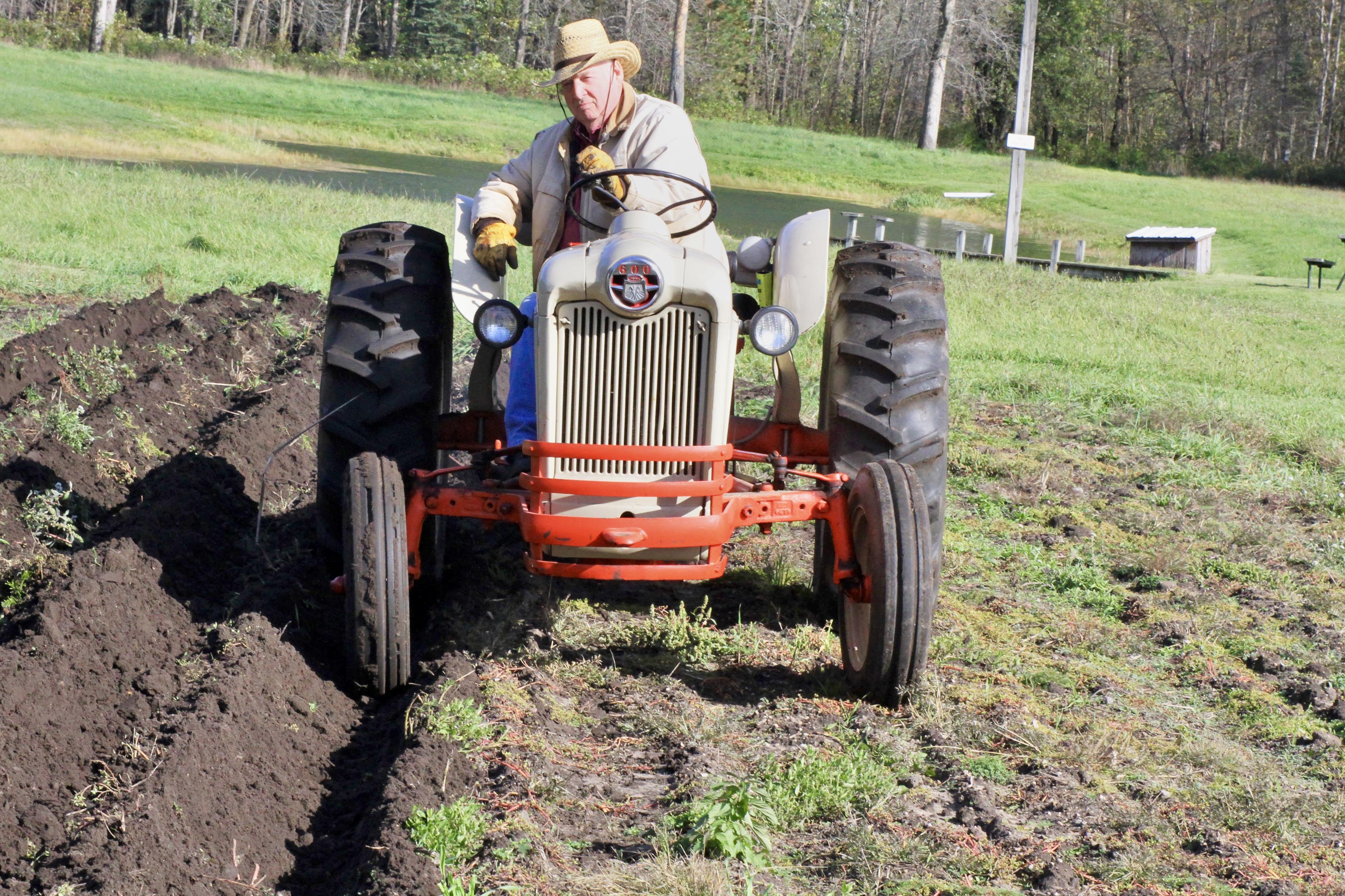 A man driving a tractor