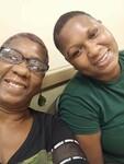 A couple of people smiling for the camera