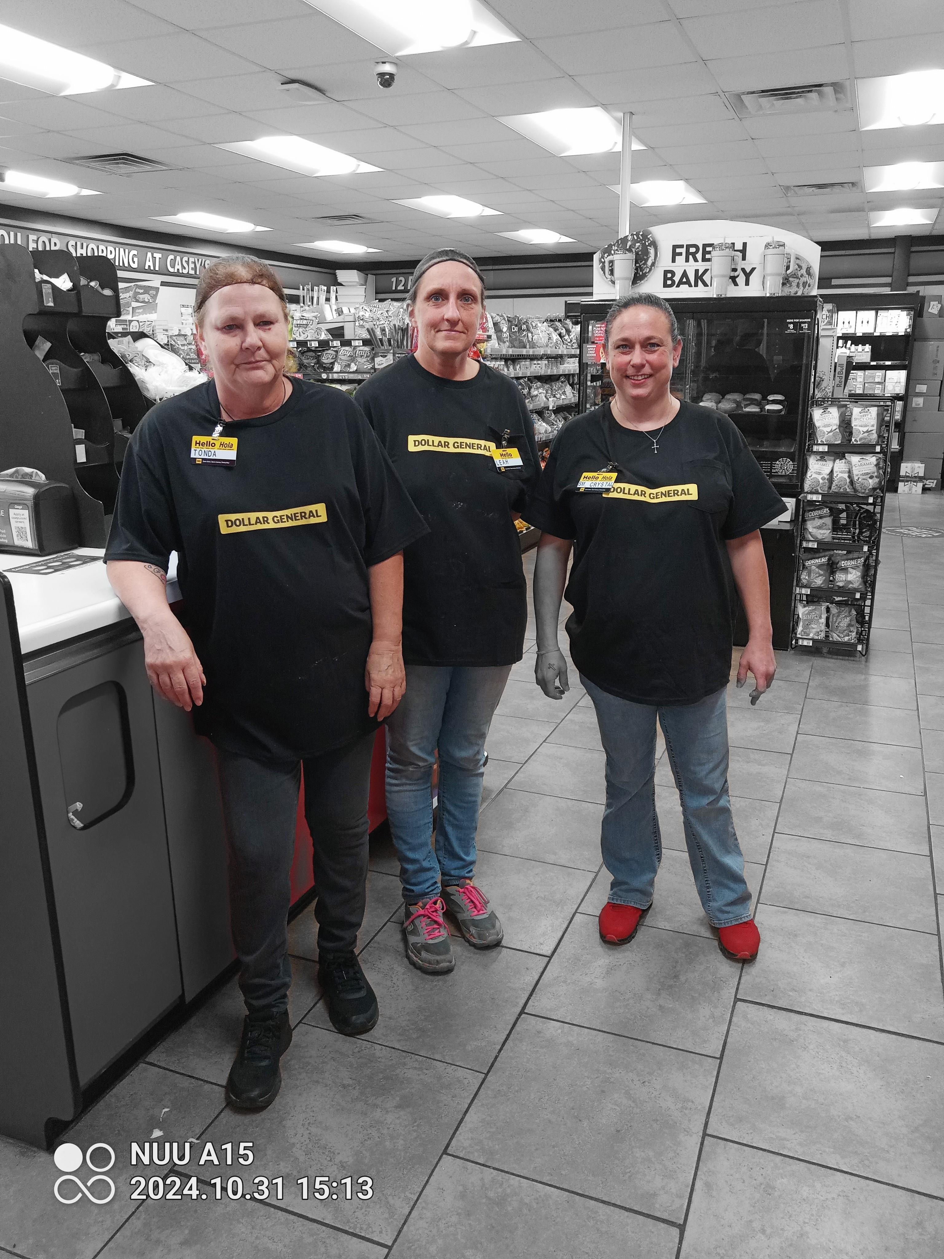 A group of people standing in a store