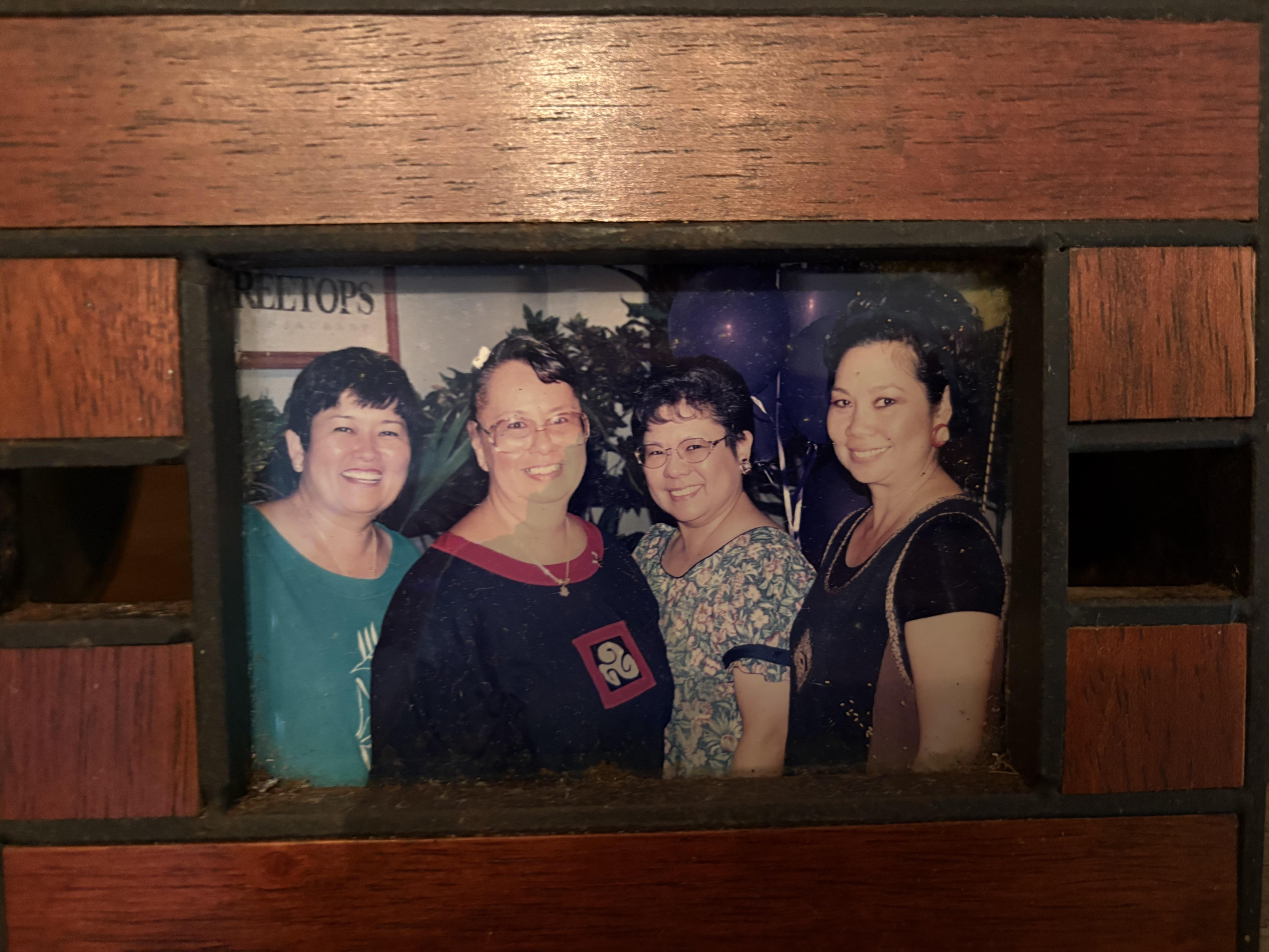 A group of women in a frame