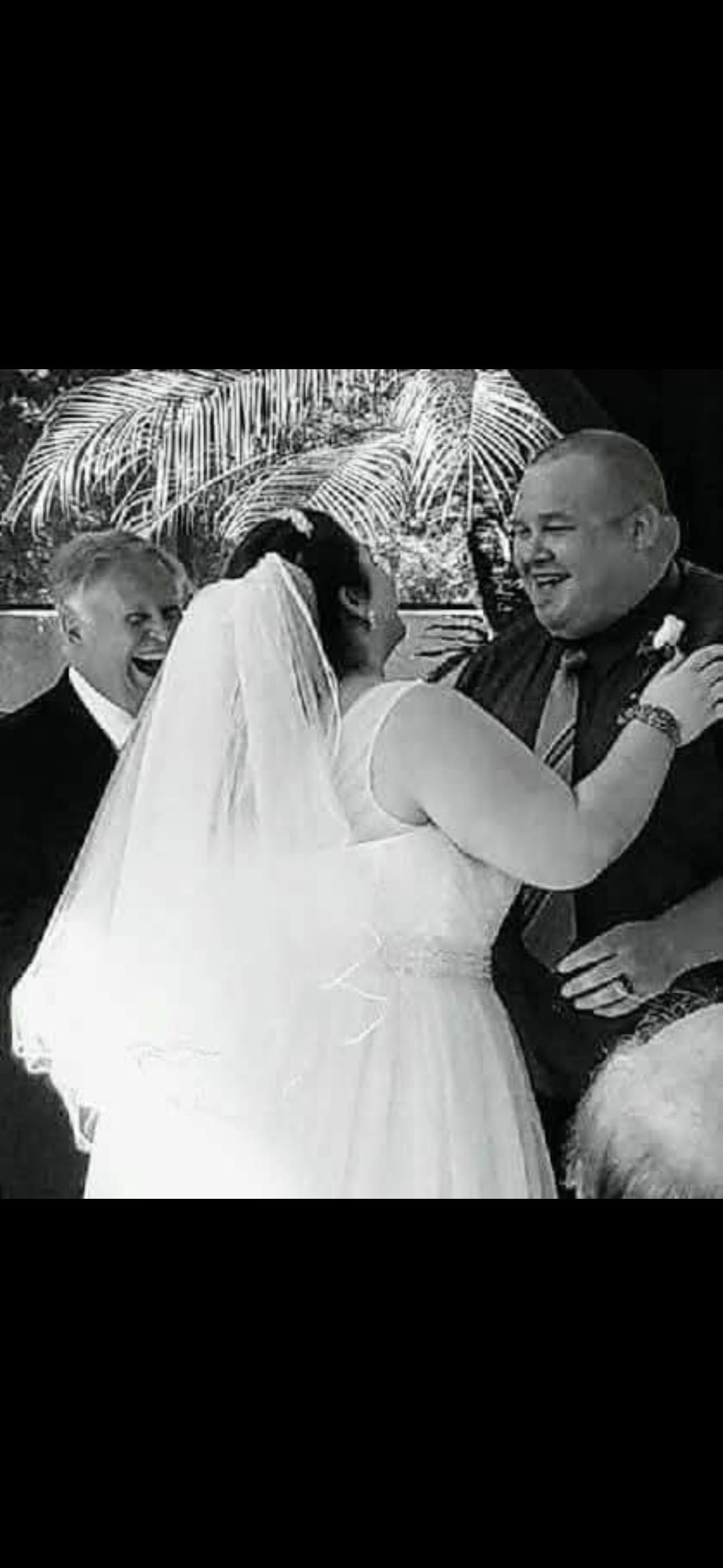 A bride and groom laughing