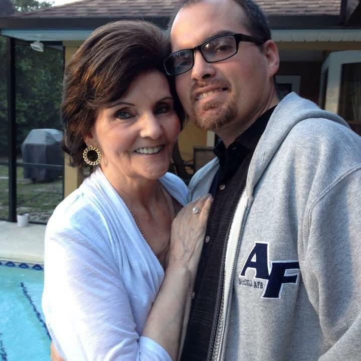 A man and woman posing for a picture