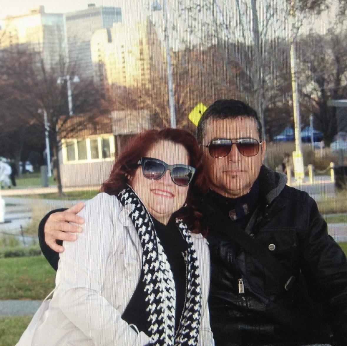 A man and woman sitting on a bench