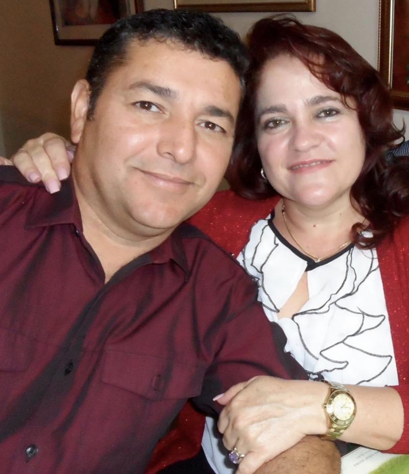 A man and woman posing for a picture