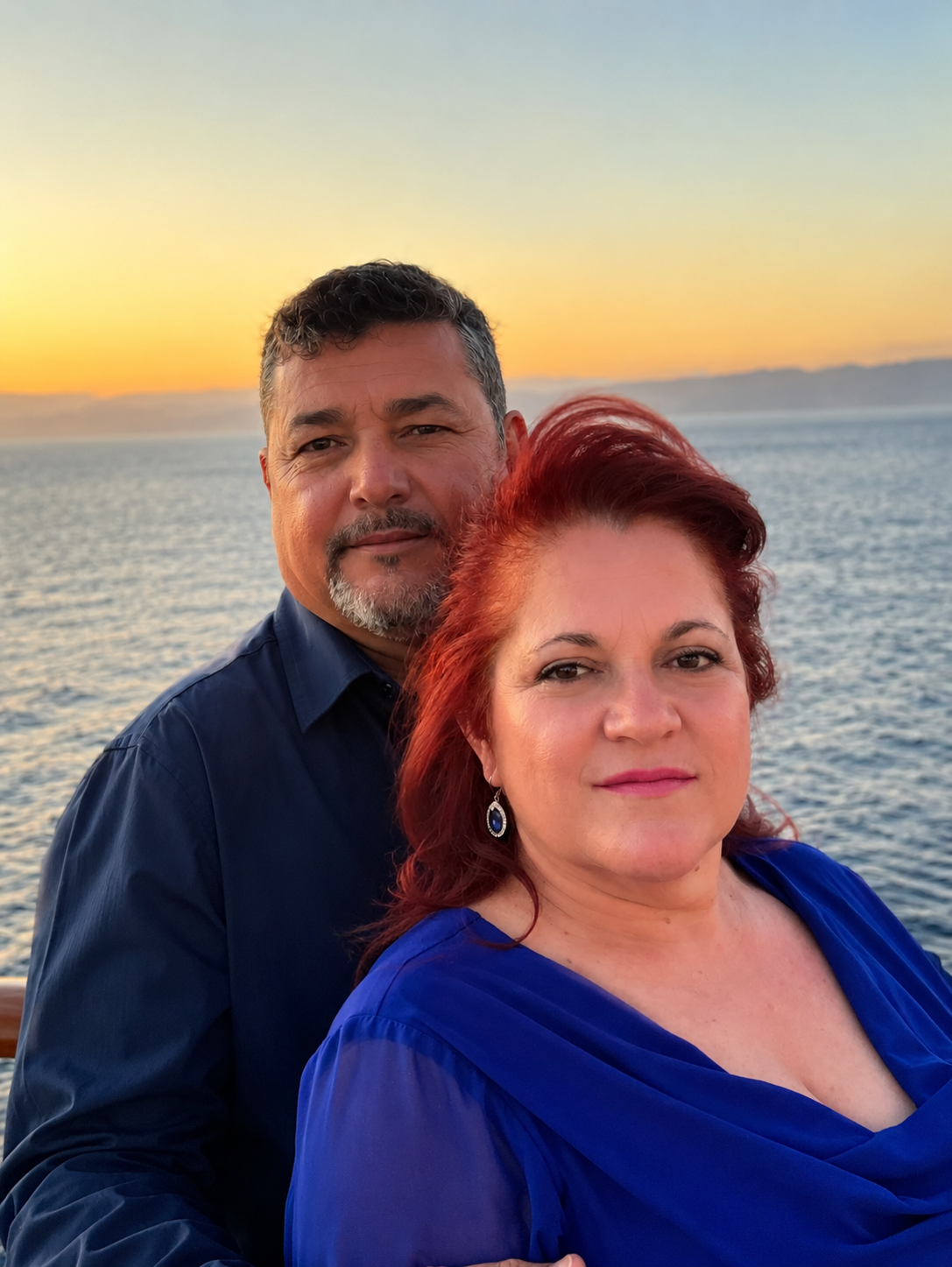 A man and woman posing for a picture
