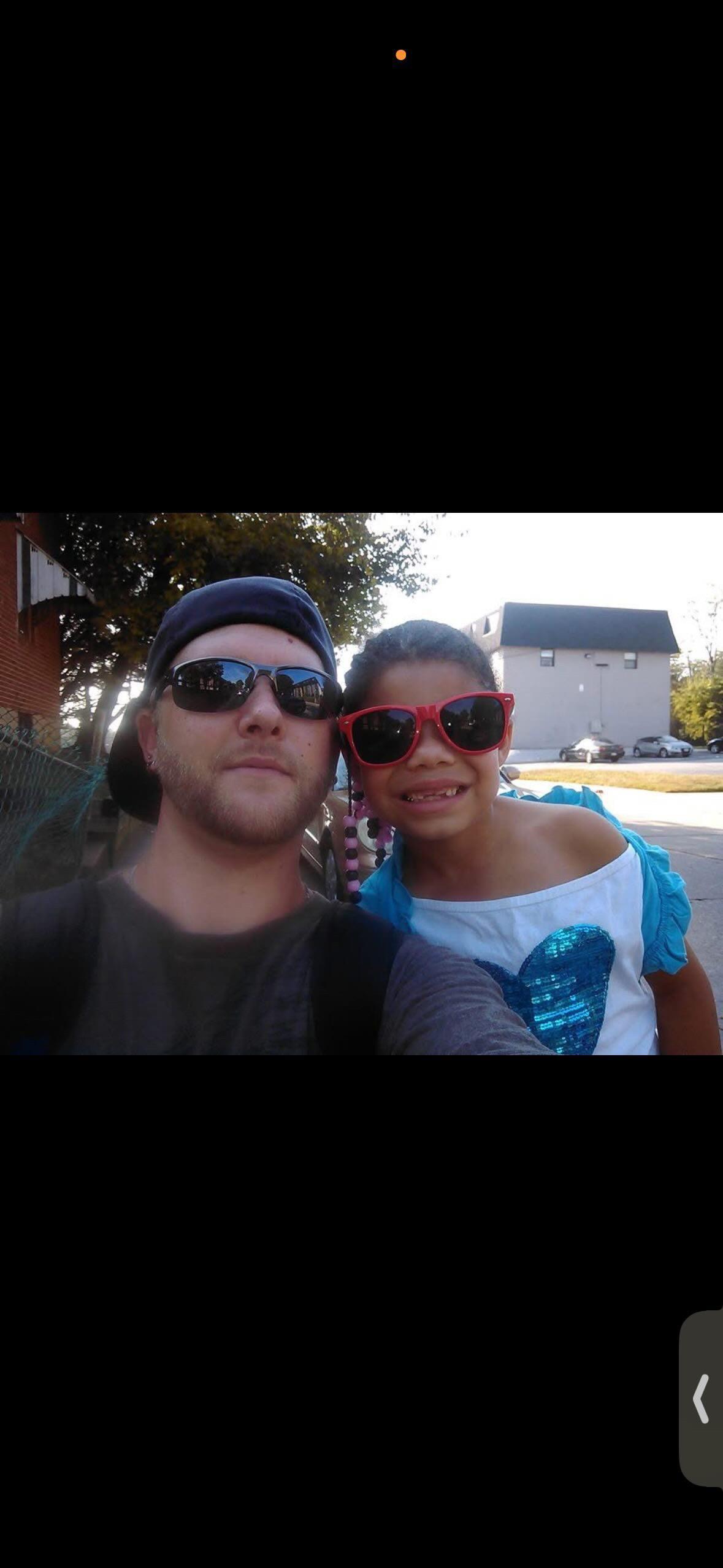 A man and a girl wearing sunglasses