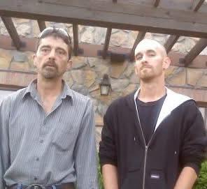 Two men standing next to each other