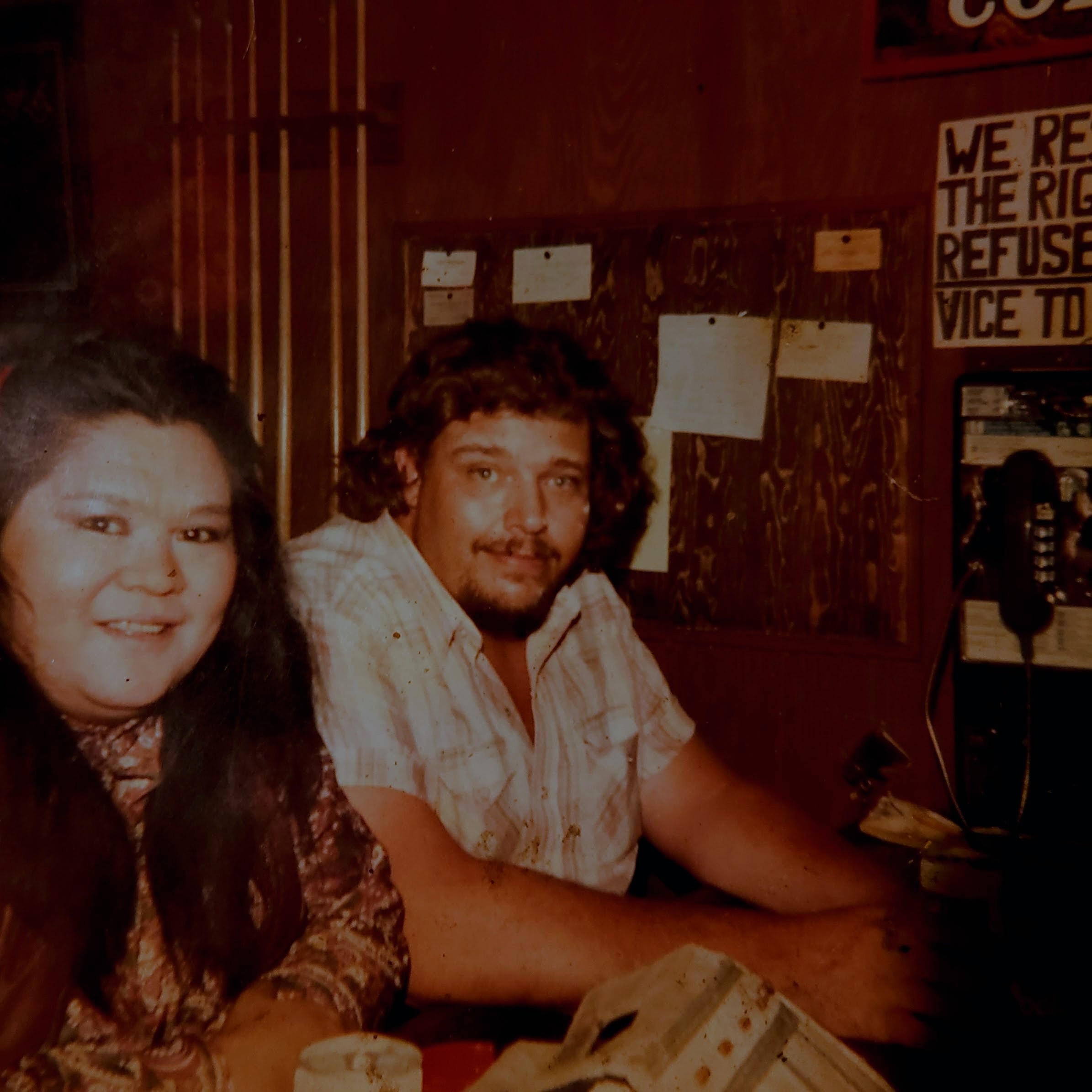 A man and woman sitting at a table