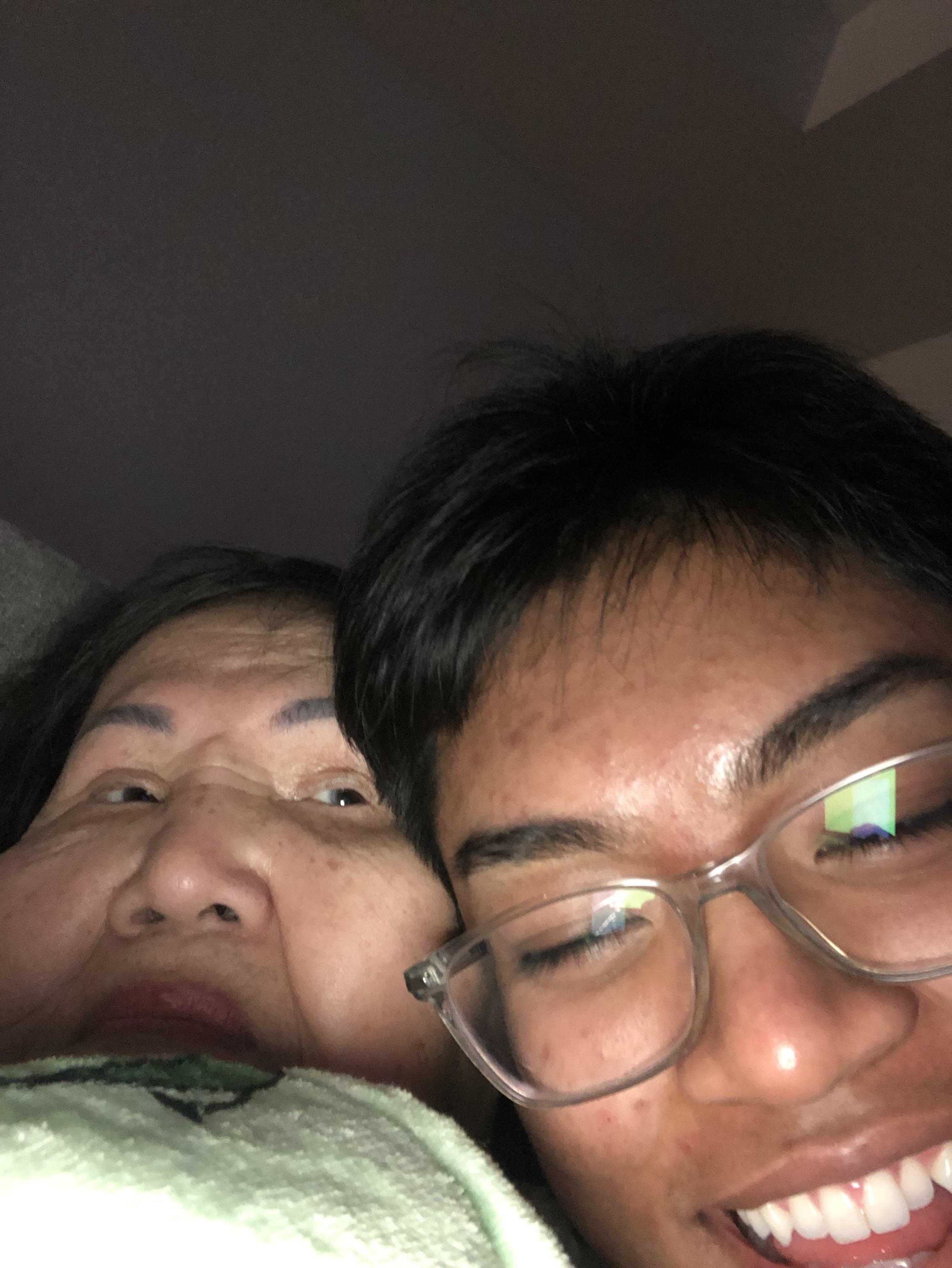 A woman and a boy taking a selfie