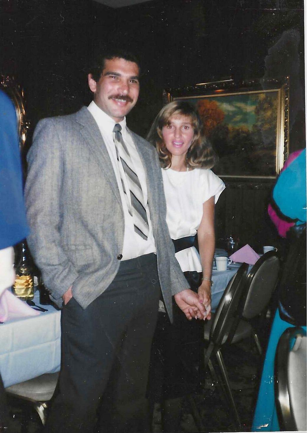 A man and woman holding hands