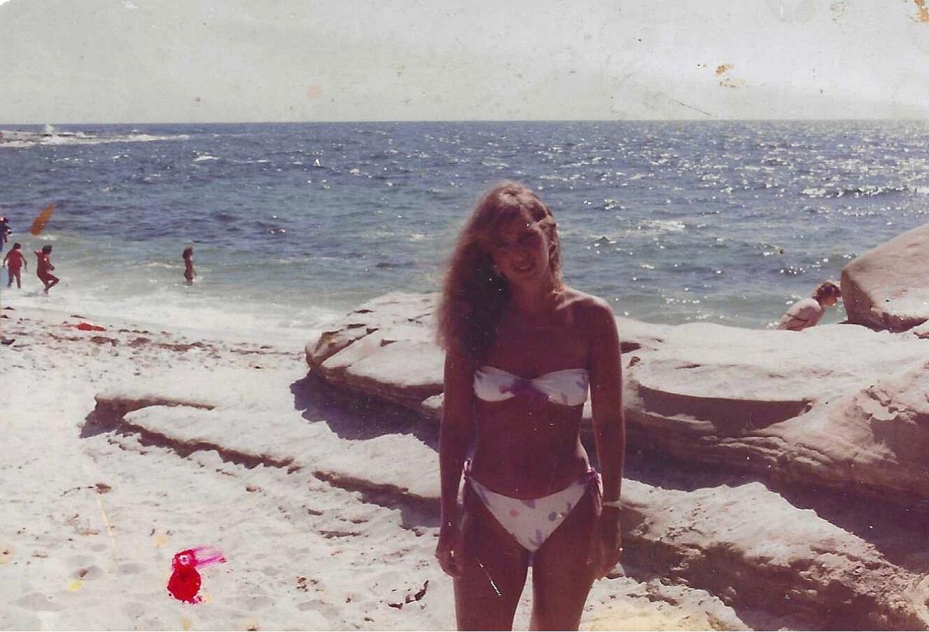 A woman in a garment on a beach