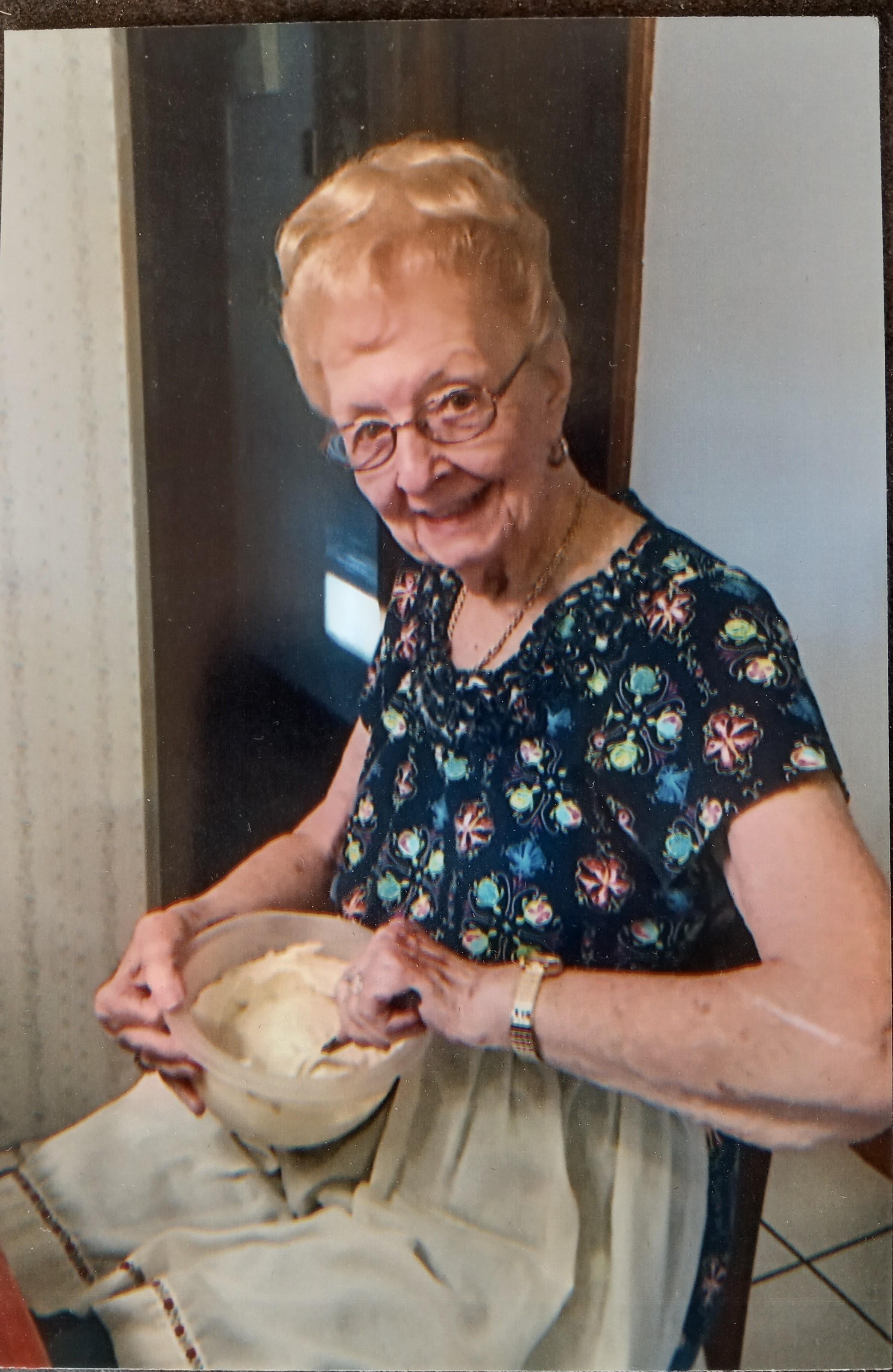 A woman mixing food in a bowl