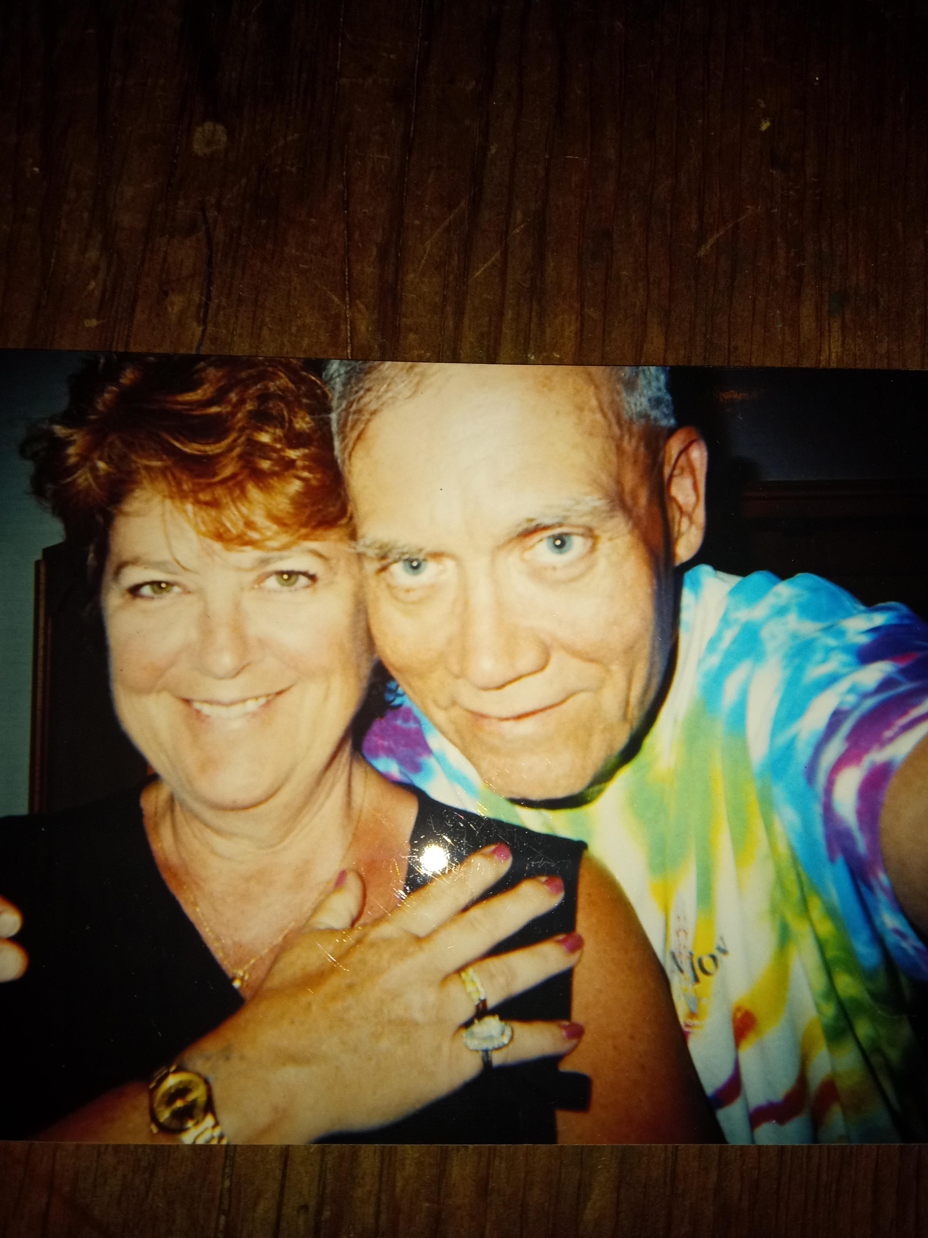 A man and woman posing for a picture