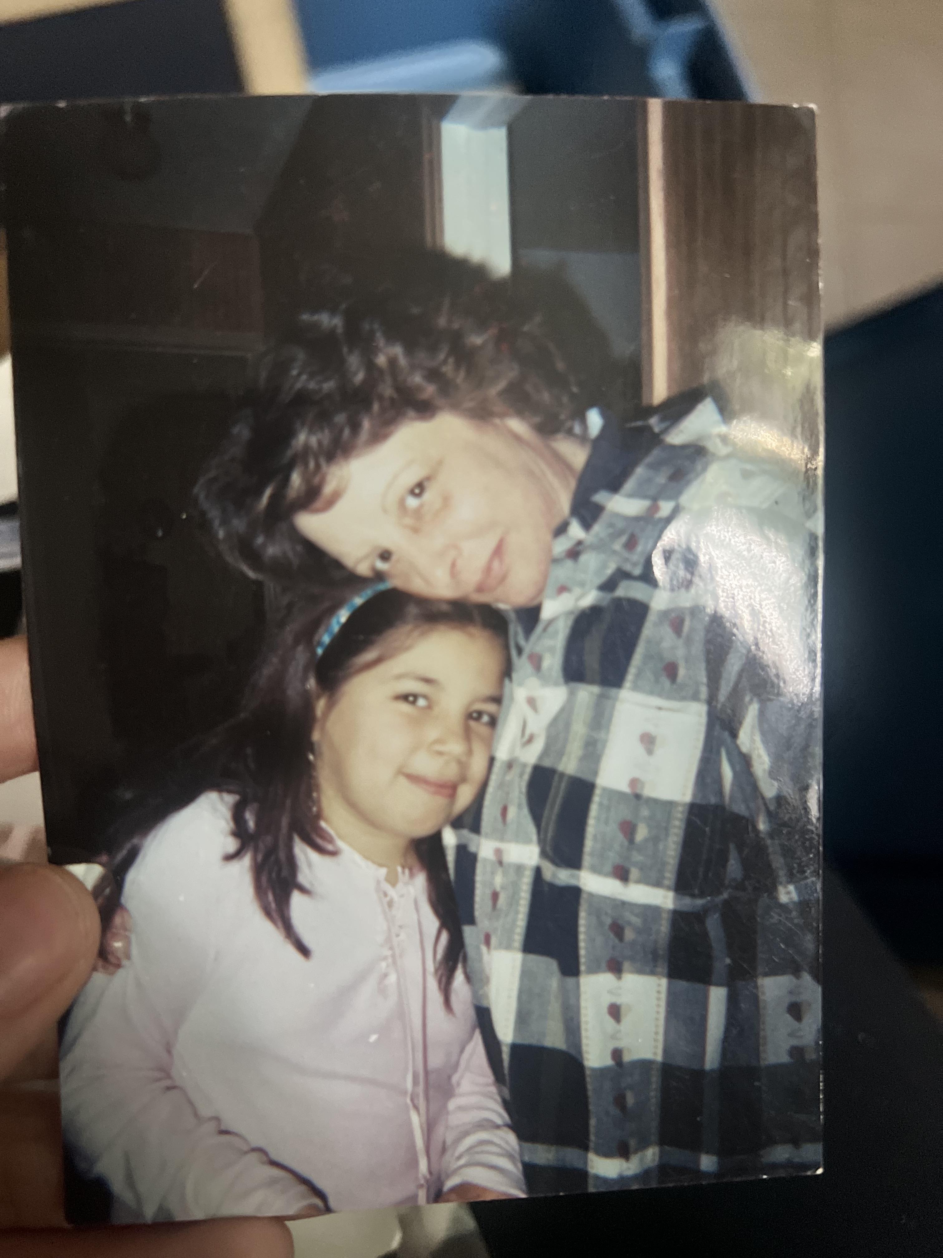 A woman and a girl posing for a picture