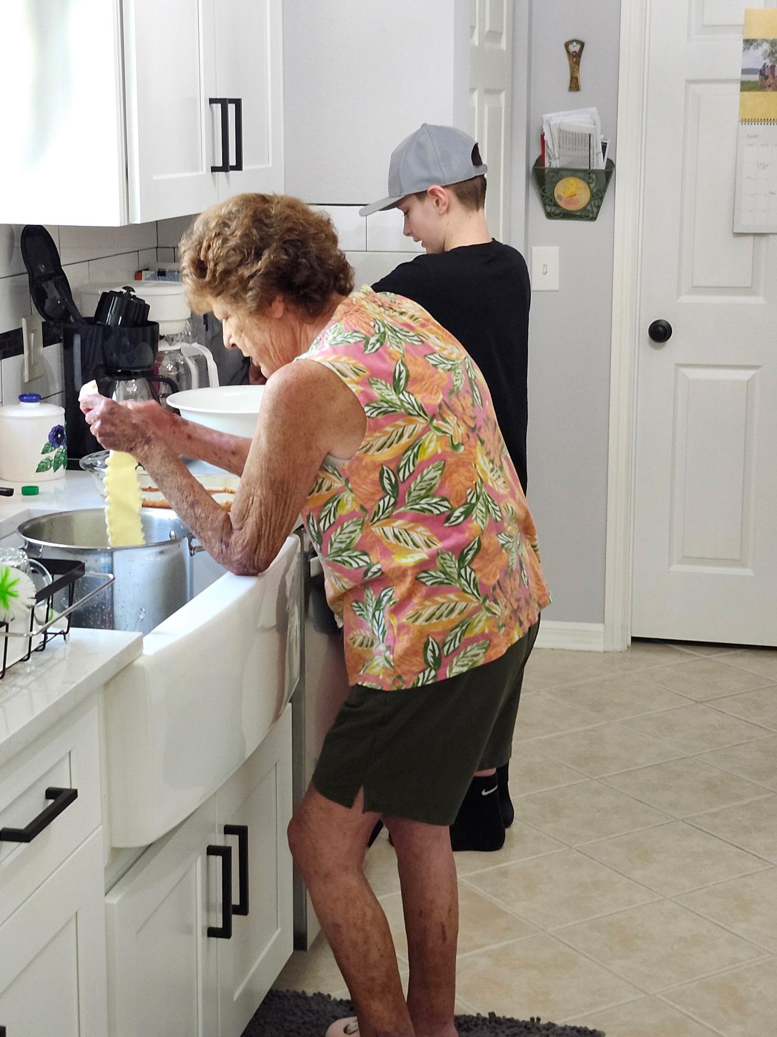 A woman and boy in a kitchen