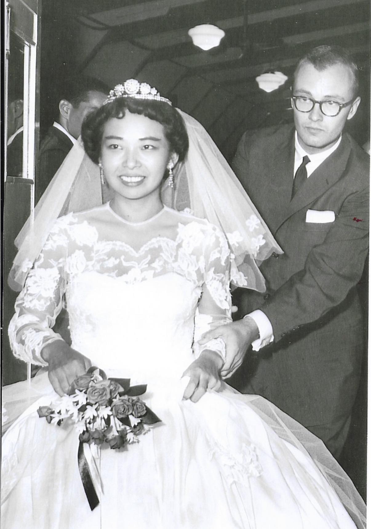 A man in a suit and a woman in a wedding dress
